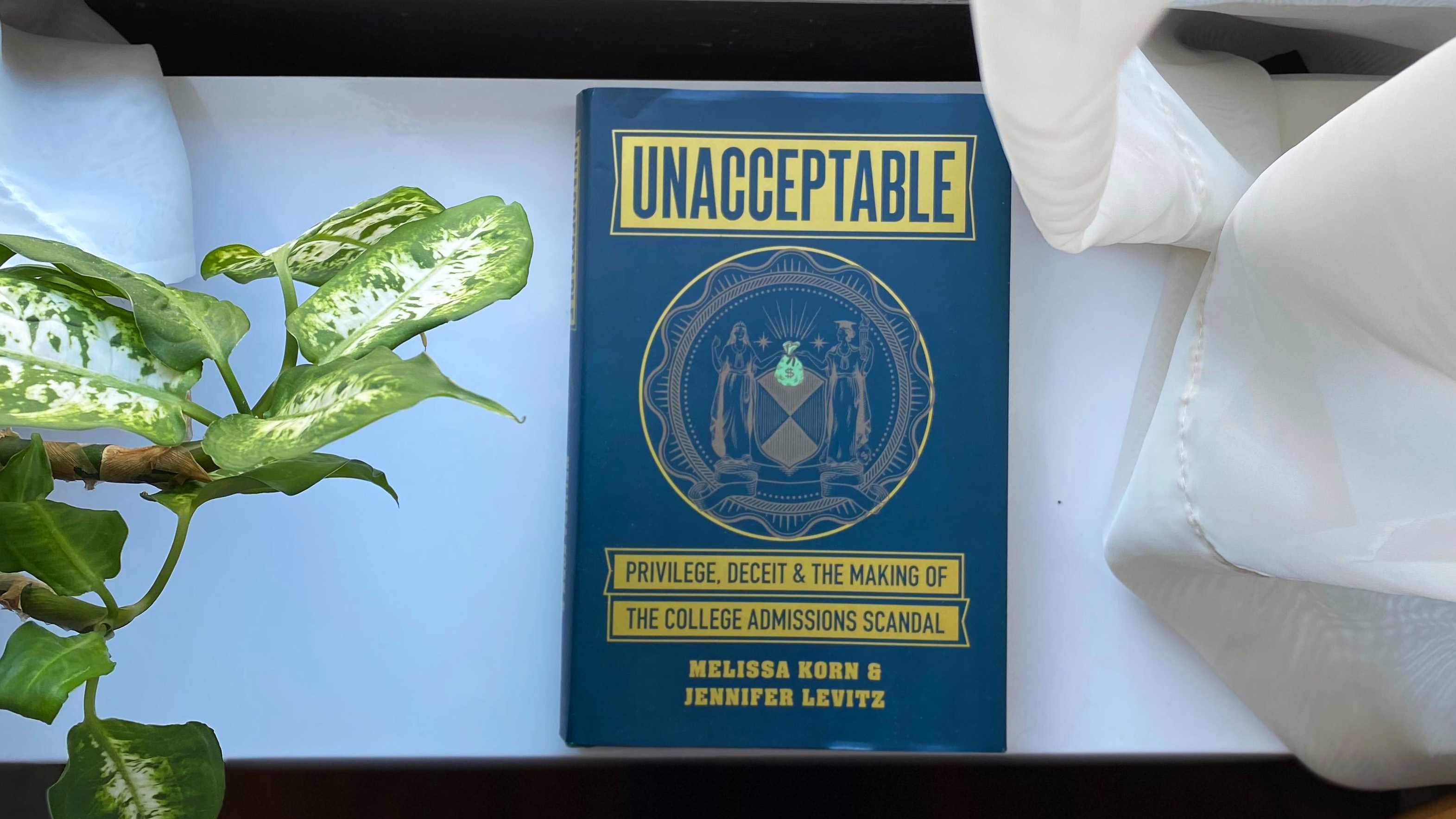 A new book tells the story behind Operation Varsity Blues, the largest college admissions scandal ever prosecuted by the U.S. Department of Justice. (NPR)