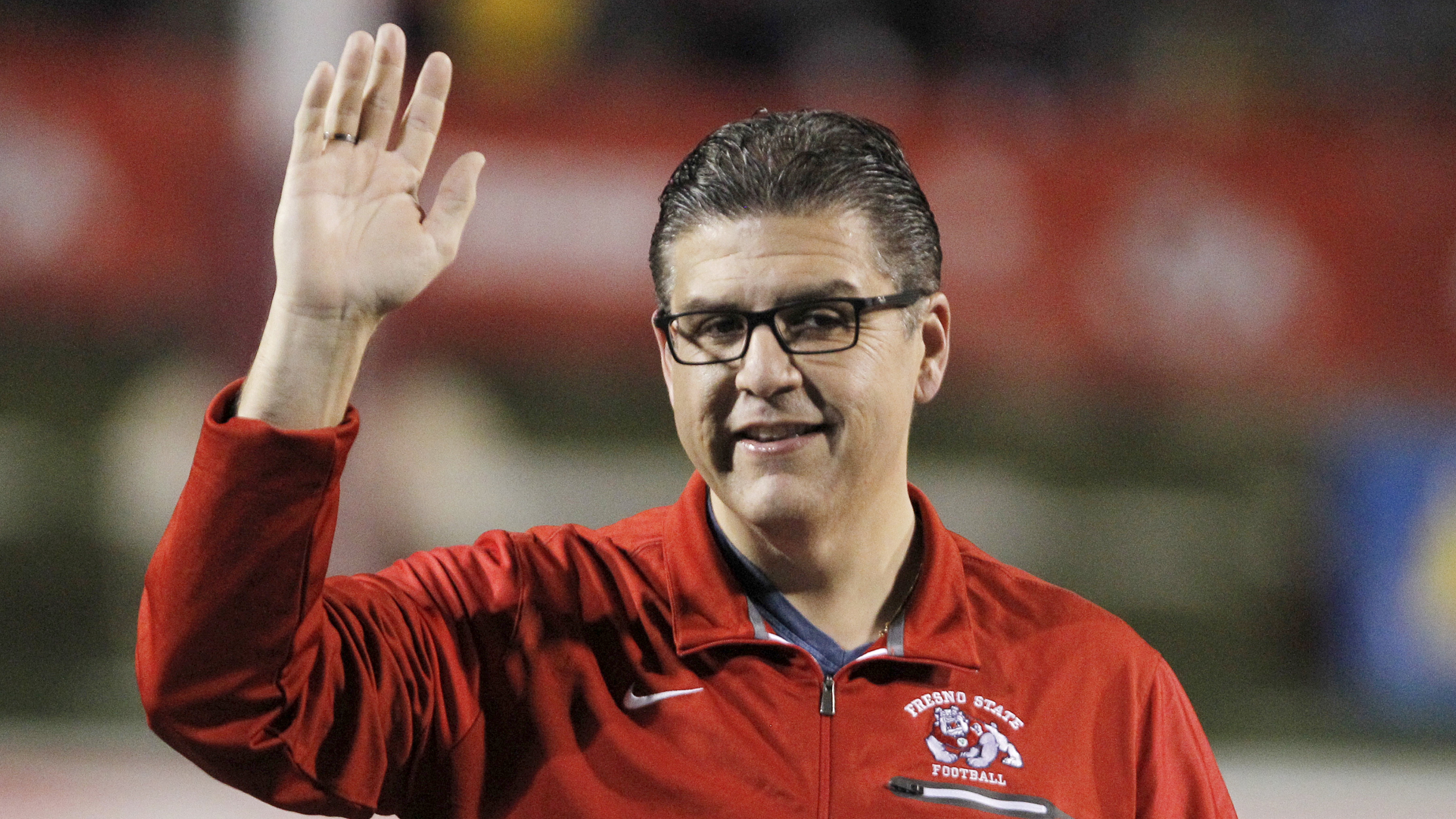 California State University, Fresno, President Joseph I. Castro waves to the crowd before an NCAA college football game against BYU in Fresno, Calif. on Nov. 4, 2017. Castro has been chosen as the chancellor of the California State University, becoming the first person of color to lead the nation