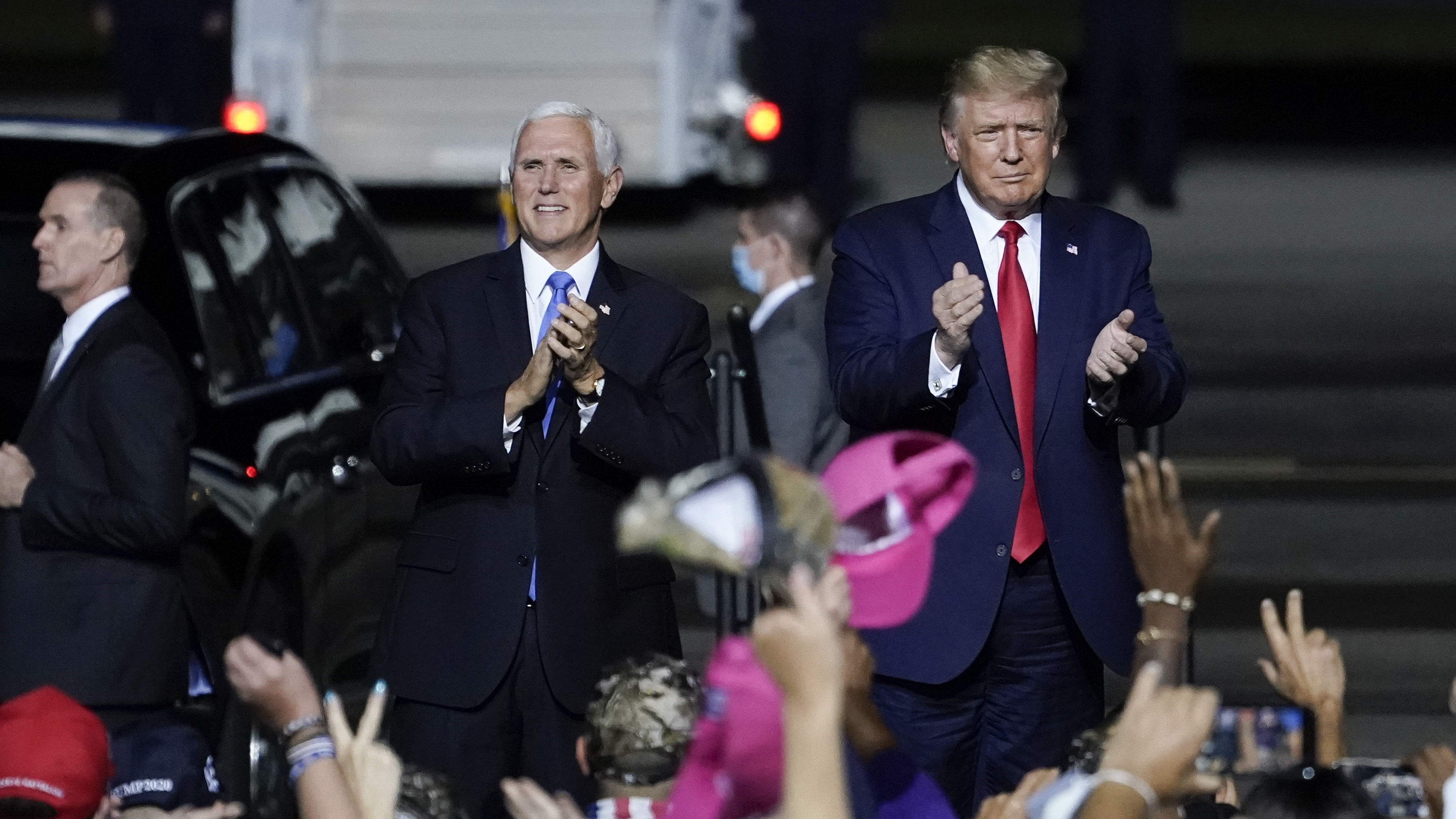 President Trump and Vice President Pence arrive for a campaign rally in Newport News, Va., on Sept. 25 — several days before Trump tested positive for the coronavirus.