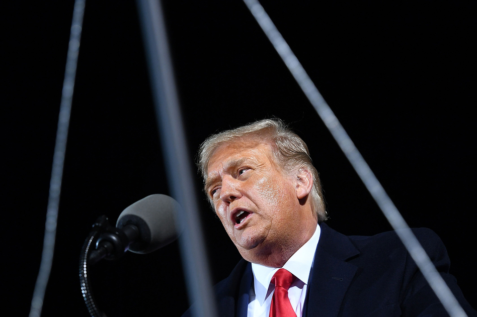 President Donald Trump speaks Wednesday at a campaign rally at Duluth International Airport in Minnesota. The president, who has tested positive for the coronavirus, "remains fatigued but in good spirits," White House physician Sean Conley said Friday. (Mandel Ngan/AFP via Getty Images)