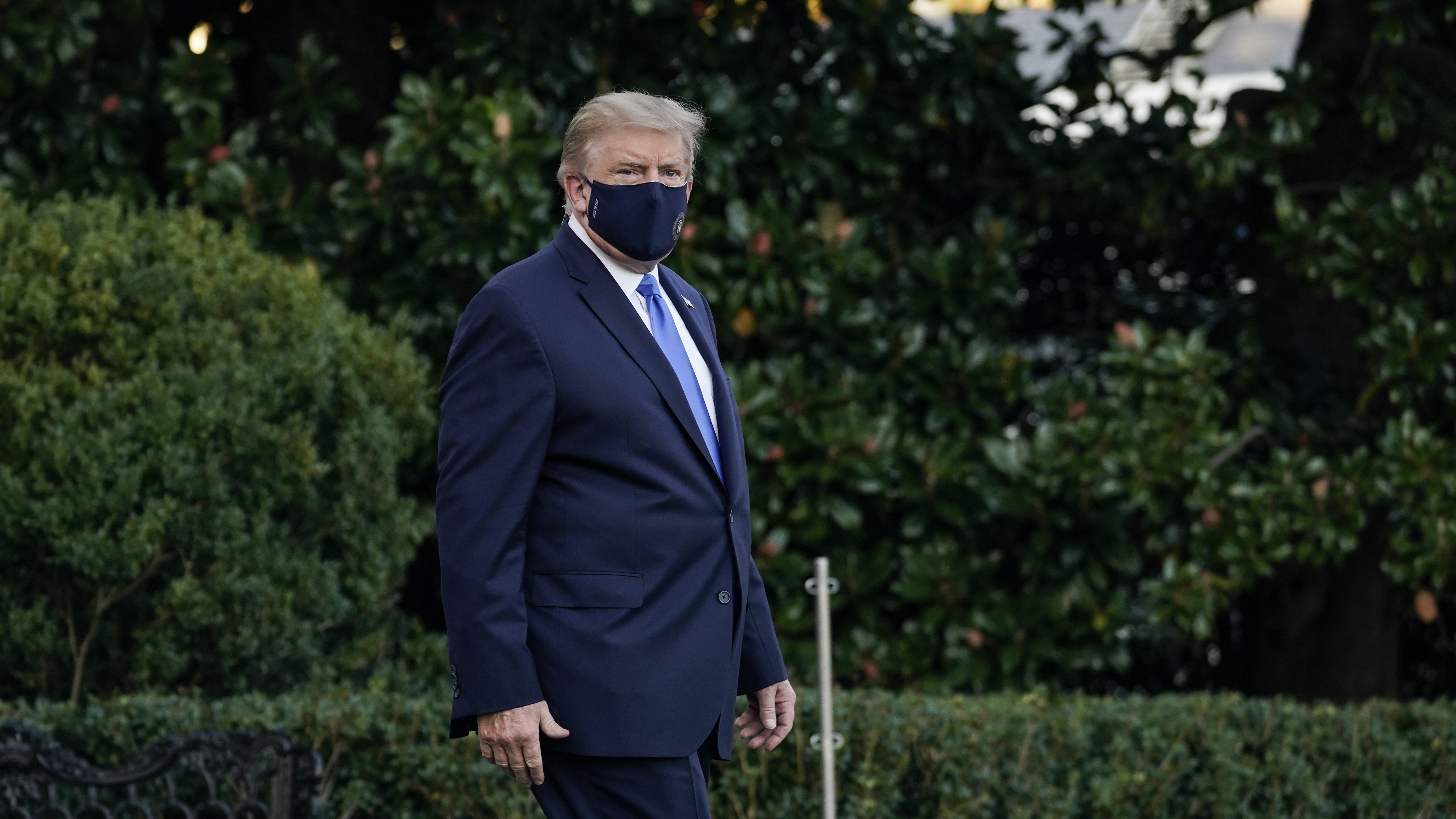 President Trump leaves the White House for Walter Reed National Military Medical Center on Friday. On Saturday night he said in a video that he was feeling better as he continues to receive treatment for the coronavirus. (Getty Images)