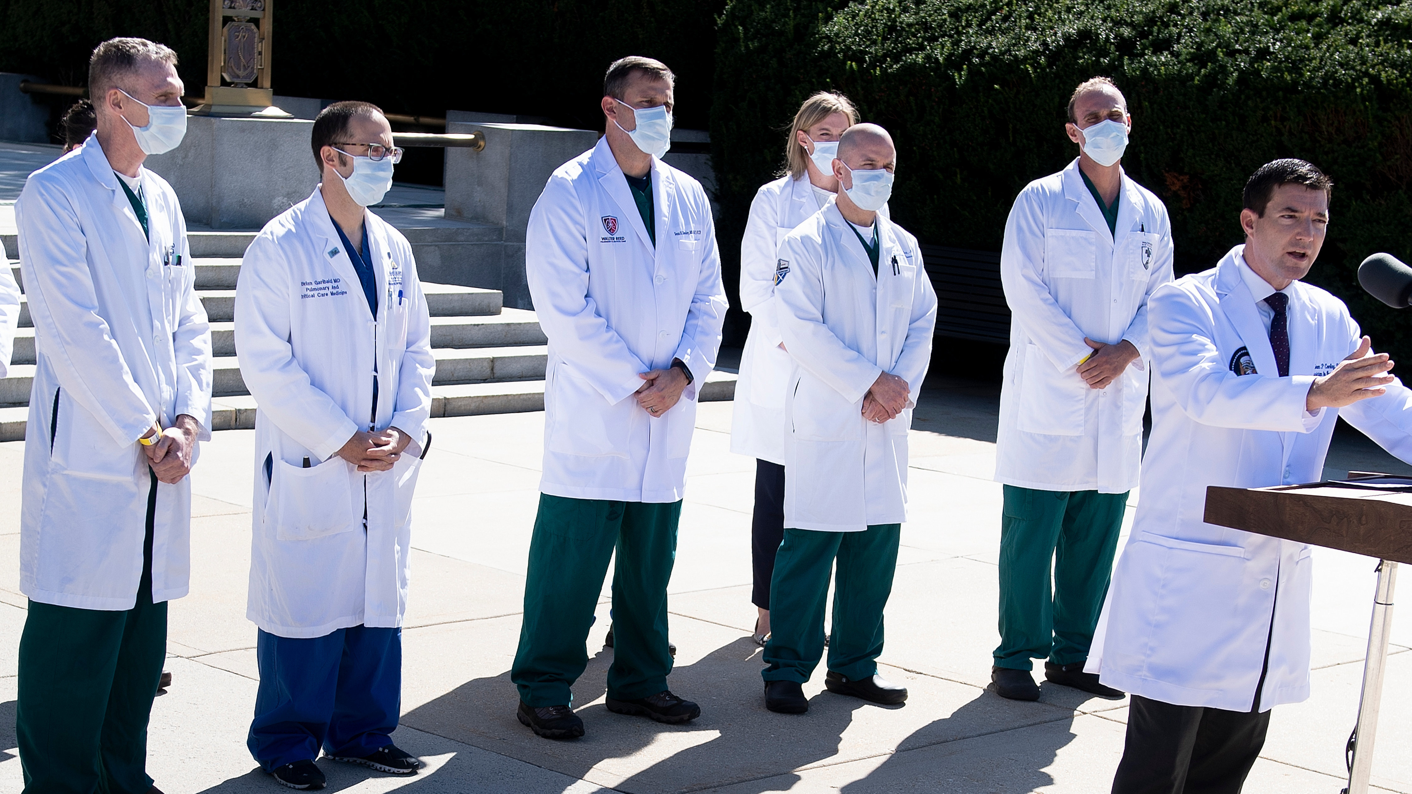 White House physician Dr. Sean Conley, with medical staff, gives an update on the condition of President Trump on Saturday at Walter Reed Medical Center in Bethesda, Md. (AFP via Getty Images)