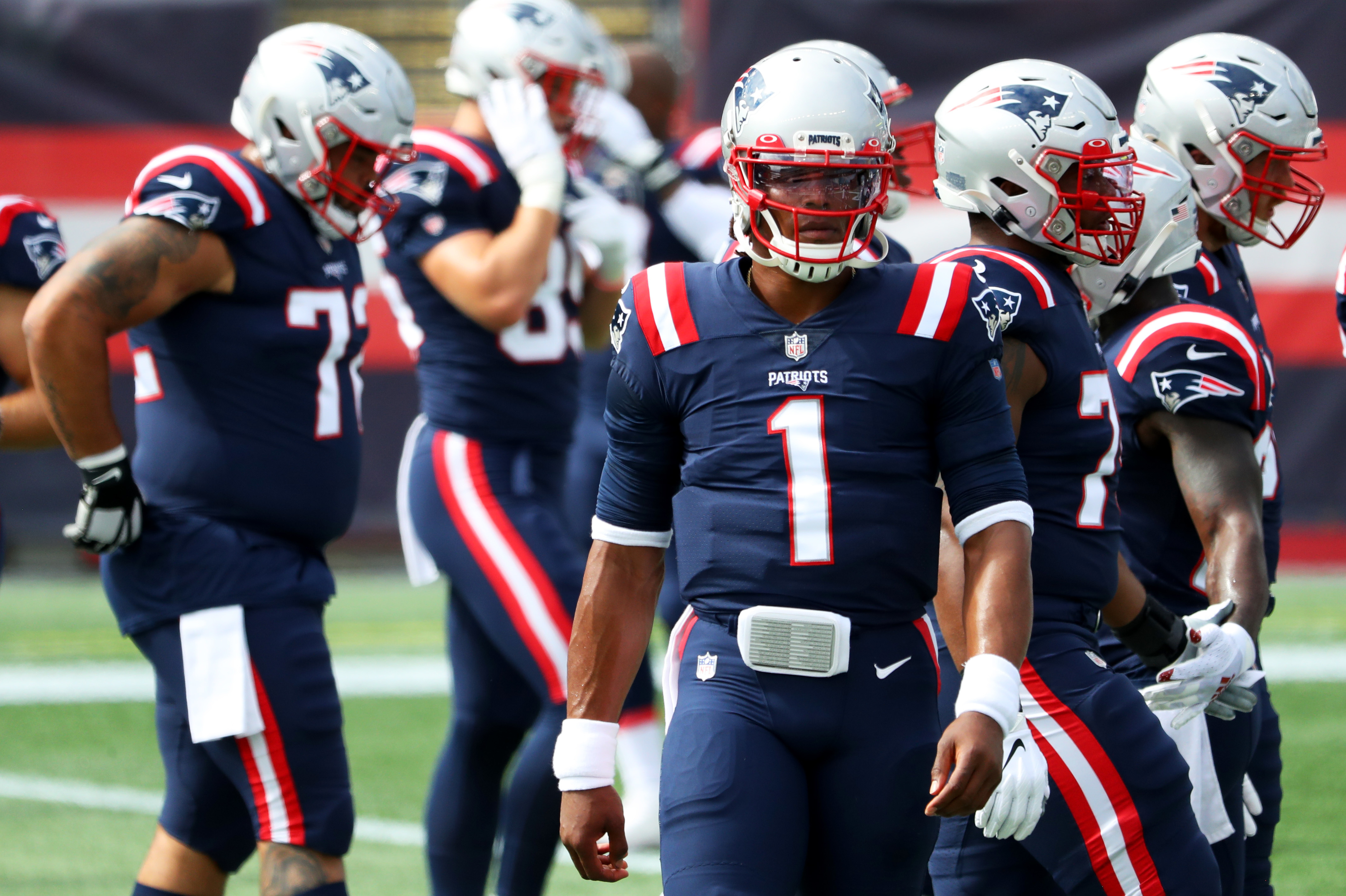 Cam Newton of the New England Patriots looks on before a game against the Las Vegas Raiders at Gillette Stadium last Sunday. A game between the Patriots and Kansas City Chiefs was postponed after players from both teams tested positive for the coronavirus. (Getty Images)