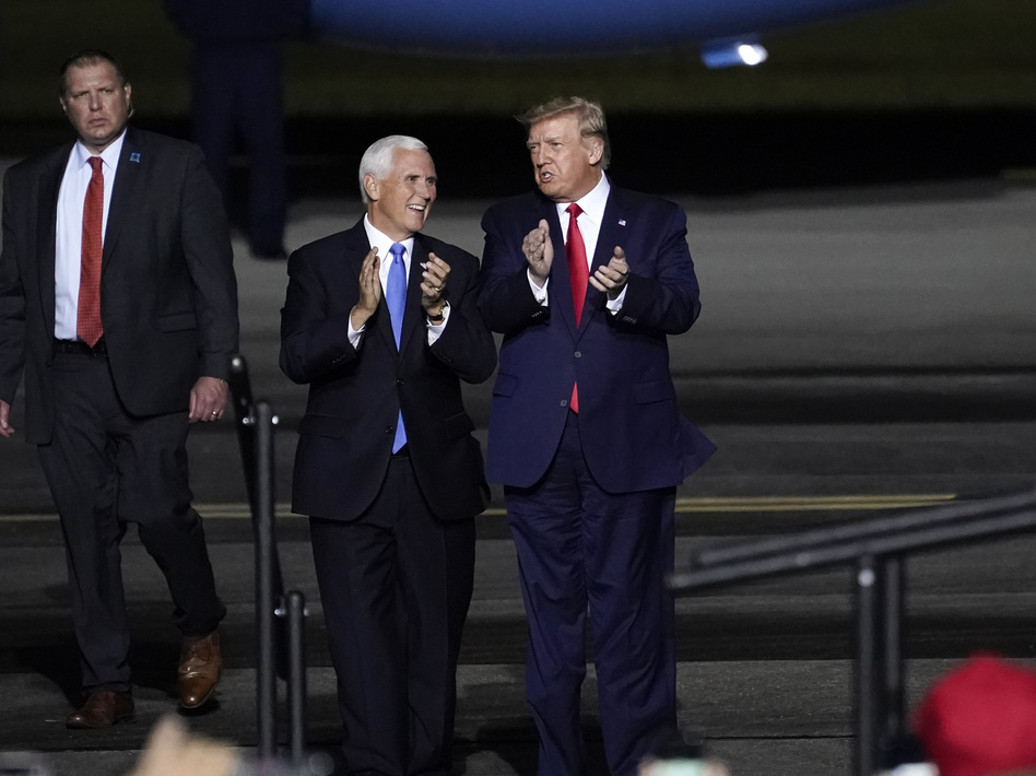 Vice President Mike Pence and President Trump at a campaign rally at Newport News, Va., on Sept. 25, a week before Trump was hospitalized with COVID-19. (Drew Angerer/Getty Images)
