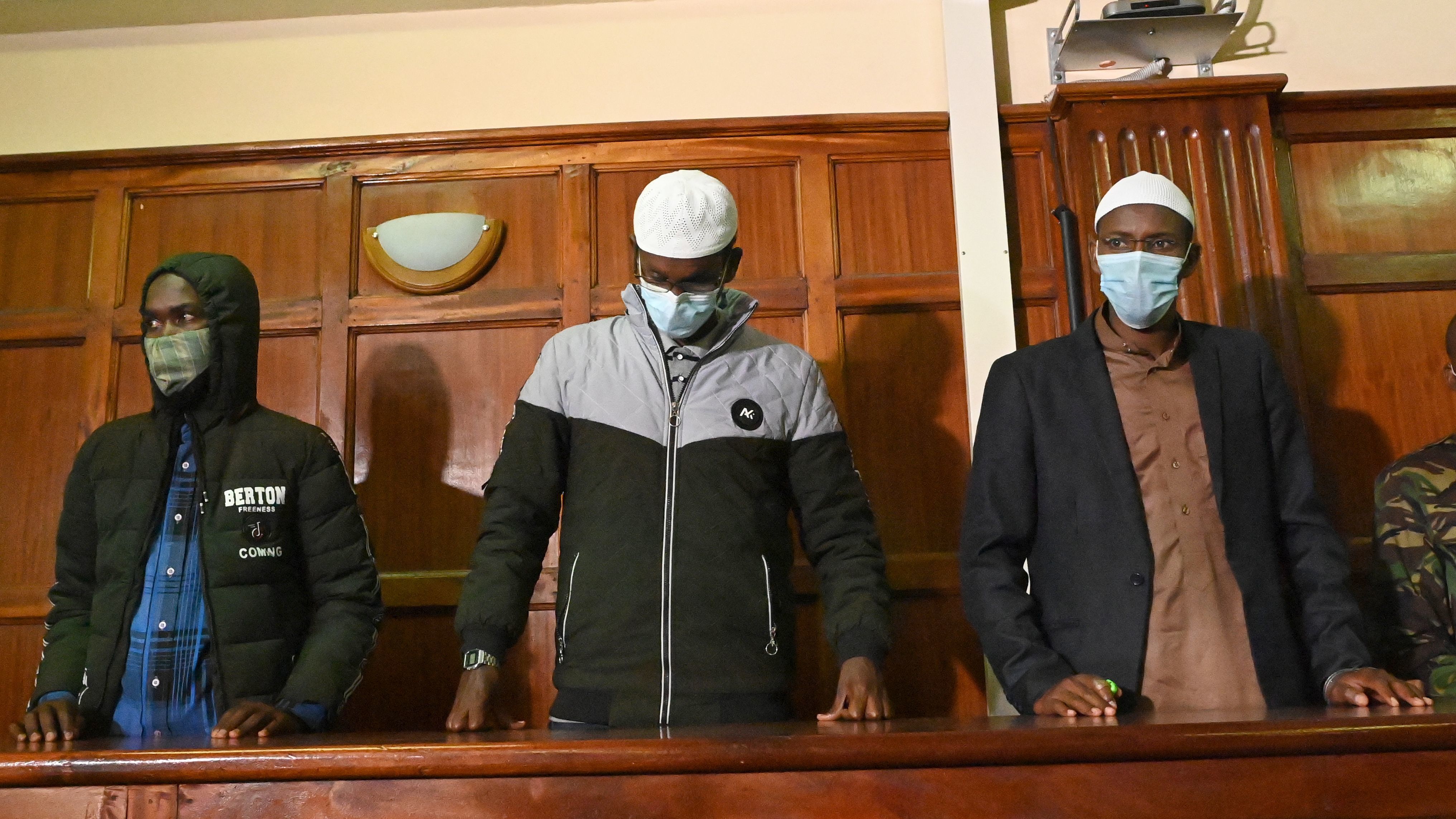 Suspects (left to right) Hassan Hussein Mustafa, Liban Abdullahi Omar, and Mohamed Ahmed Abdi standing in the dock during their appearance for their case at the Milimani court in Nairobi on Wednesday. Abdi and Mustafa were found guilty, while Omar was acquitted of charges.