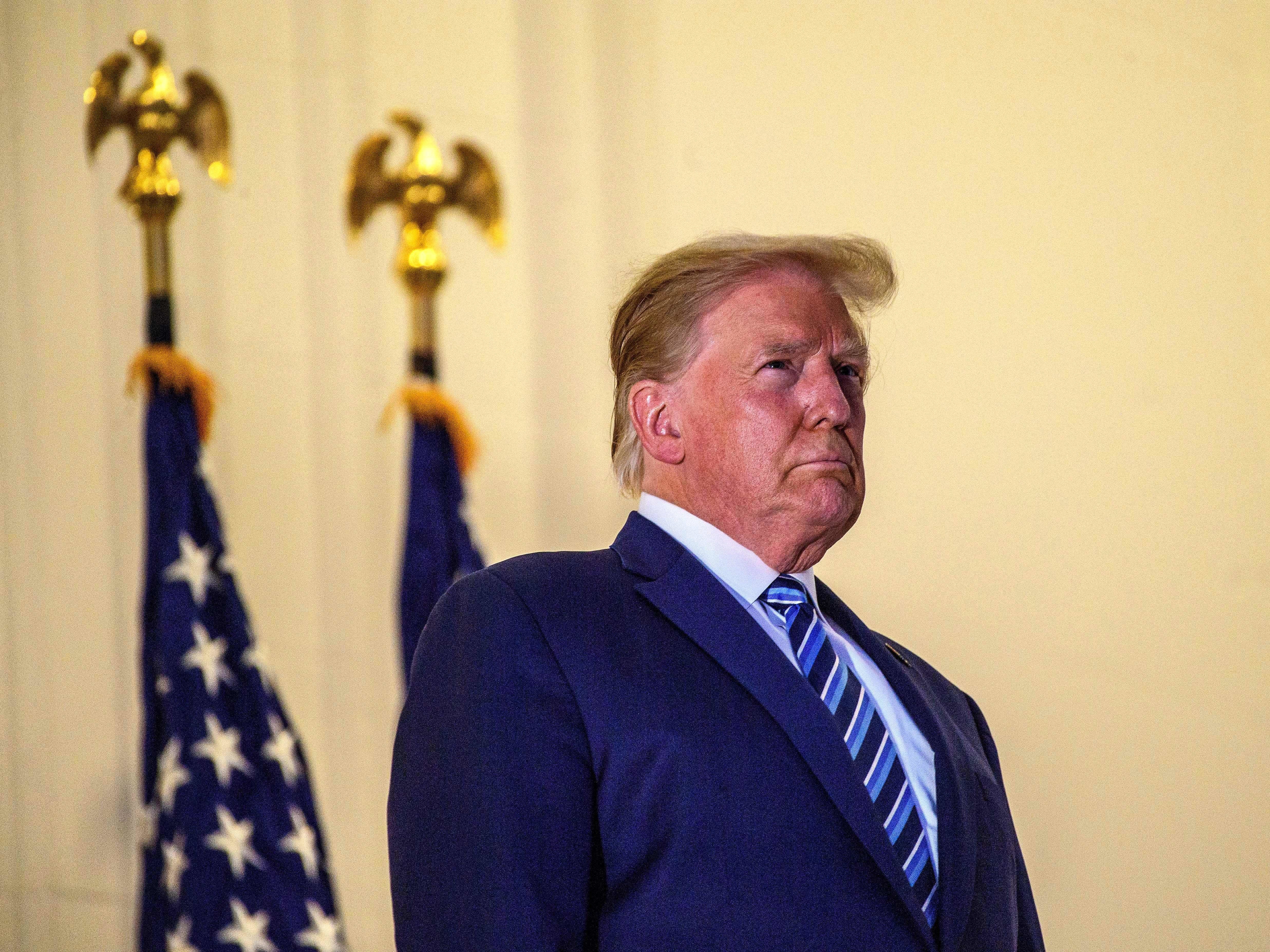 President Trump looks out from the White House on Monday after his release from Walter Reed National Military Medical Center. (AFP via Getty Images)
