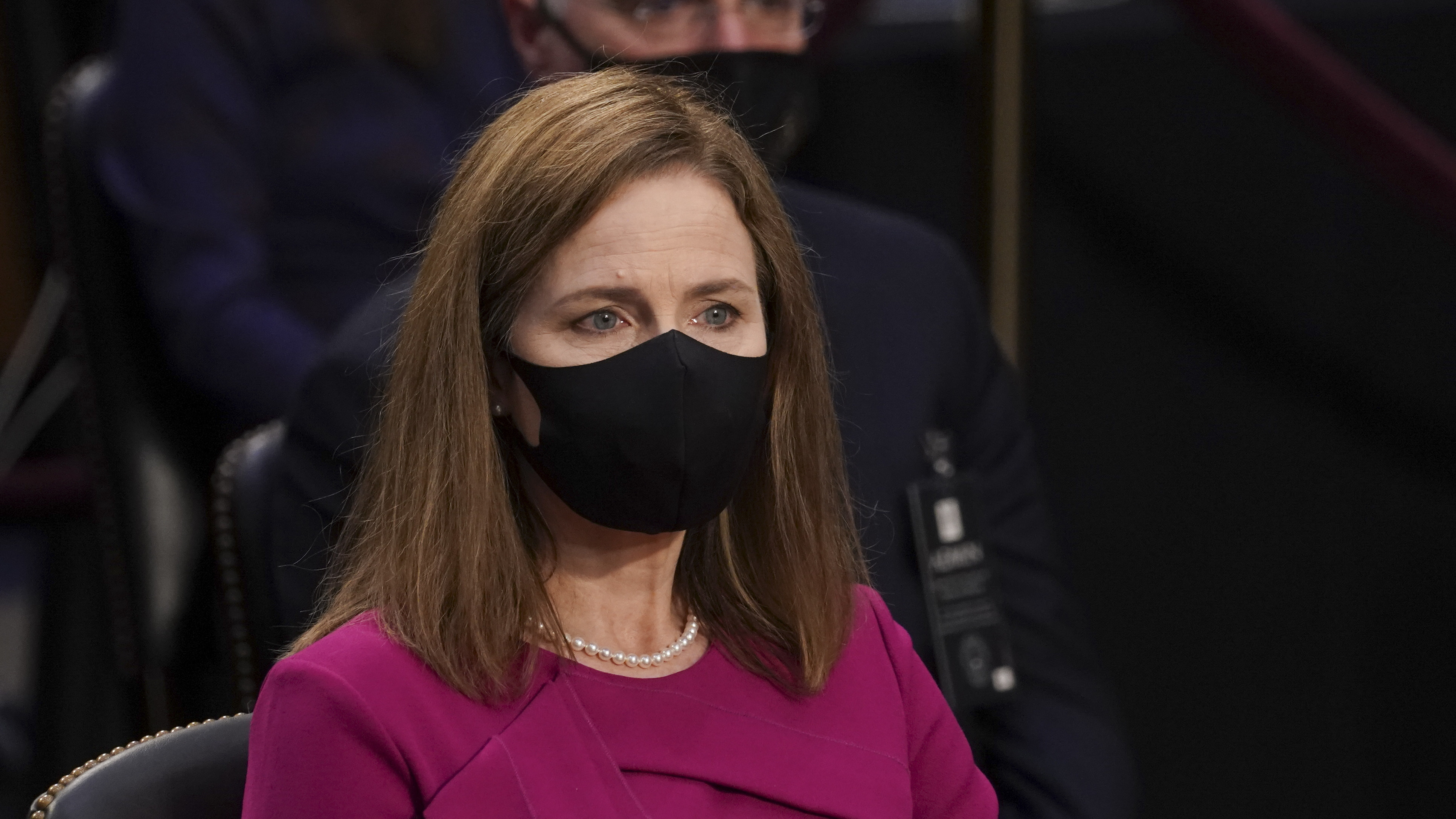 Supreme Court Justice nominee Judge Amy Coney Barrett listens as members of the Senate Judiciary Committee give their opening statements in her confirmation hearing on Monday. (Getty Images)