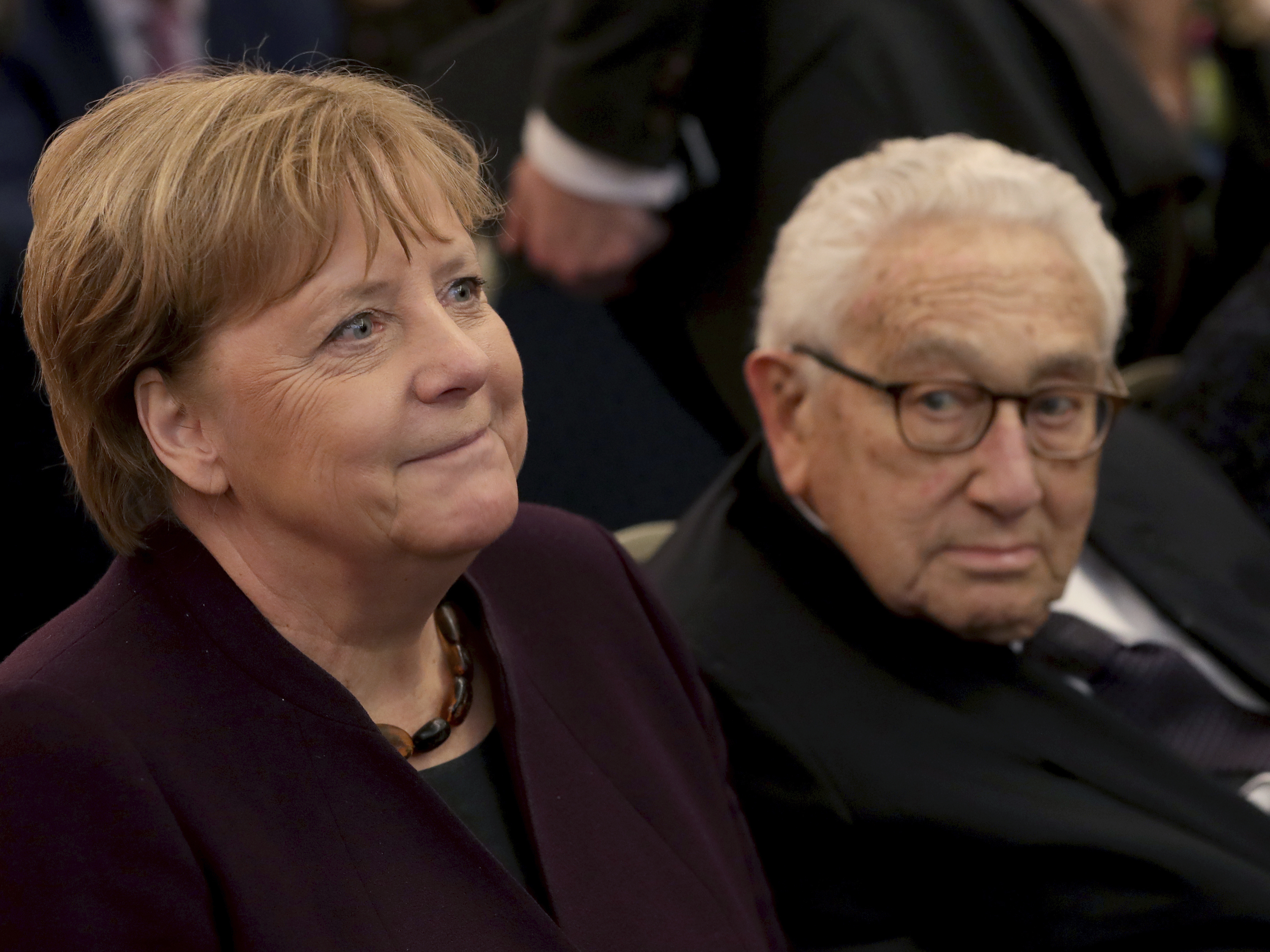 German Chancellor Angela Merkel and Henry A. Kissinger  arrive for the award ceremony for the Henry A. Kissinger Prize 2020 at the Charlottenburg palace in Berlin on Jan. 21, 2020.