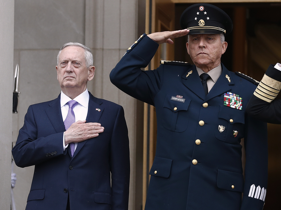 Then-Mexican Defense Secretary Gen. Salvador Cienfuegos (right) with then-U.S. Defense Secretary Jim Mattis at the Pentagon in 2017. Cienfuegos was arrested Thursday at Los Angeles International Airport.