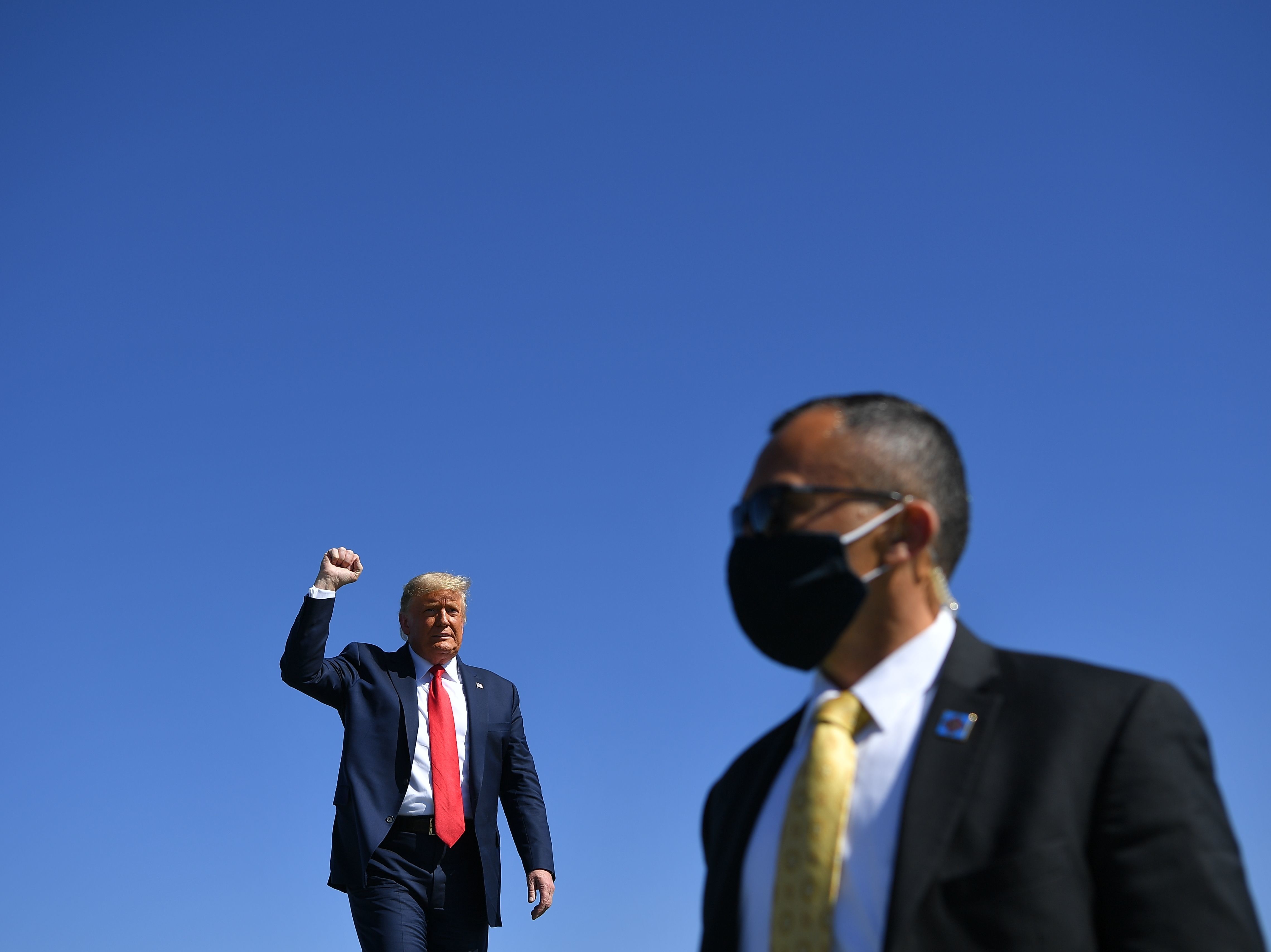 President Trump arrives to speak during a rally Monday at Prescott Regional Airport in Prescott, Ariz., one of many stops he has made recently in potential swing states. (AFP via Getty Images)