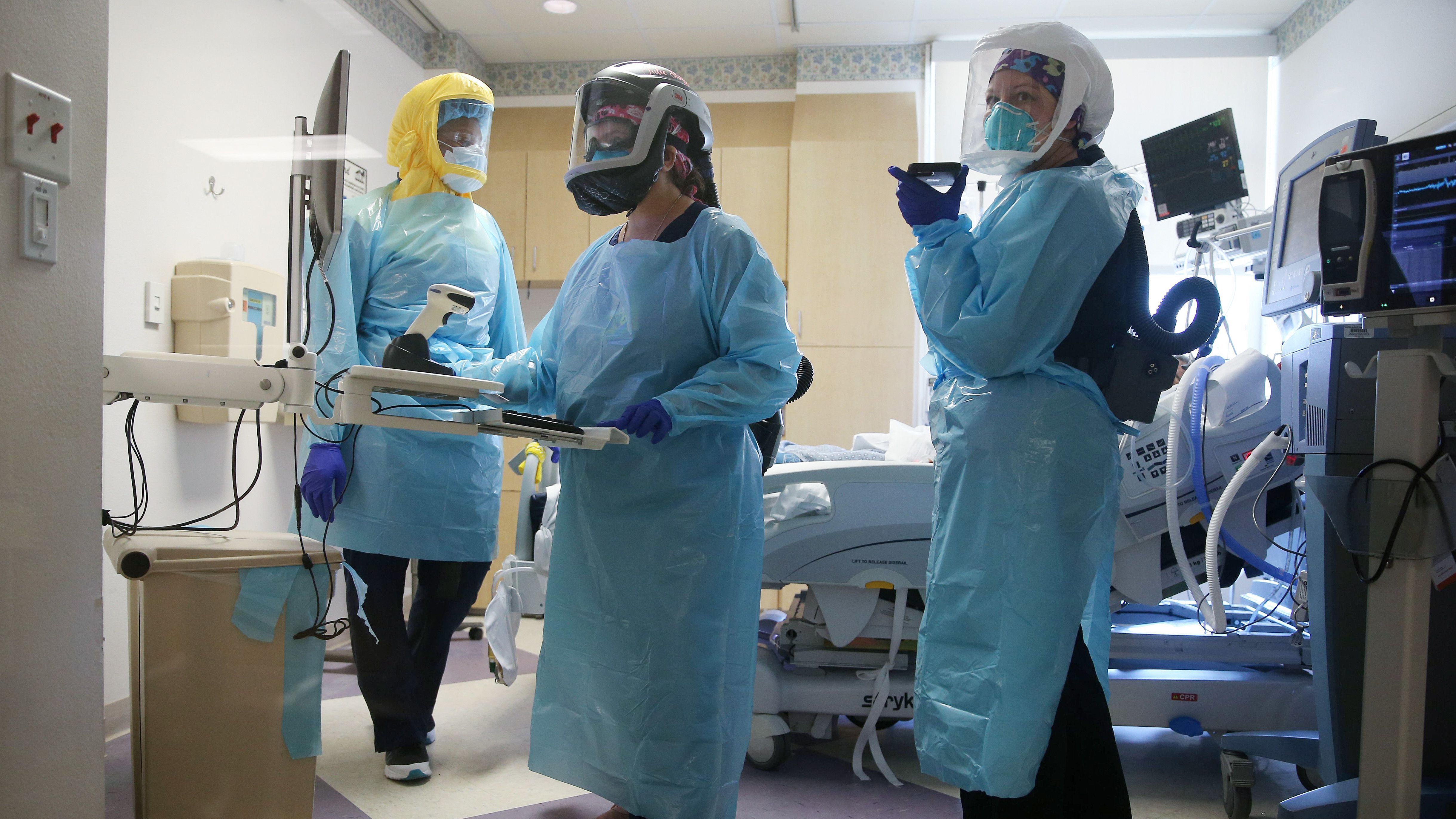 COVID-19 mortality rates are going down, according to studies of two large hospital systems, partly thanks to improvements in treatment. Here, clinicians care for a patient in July at an El Centro, Calif., hospital.