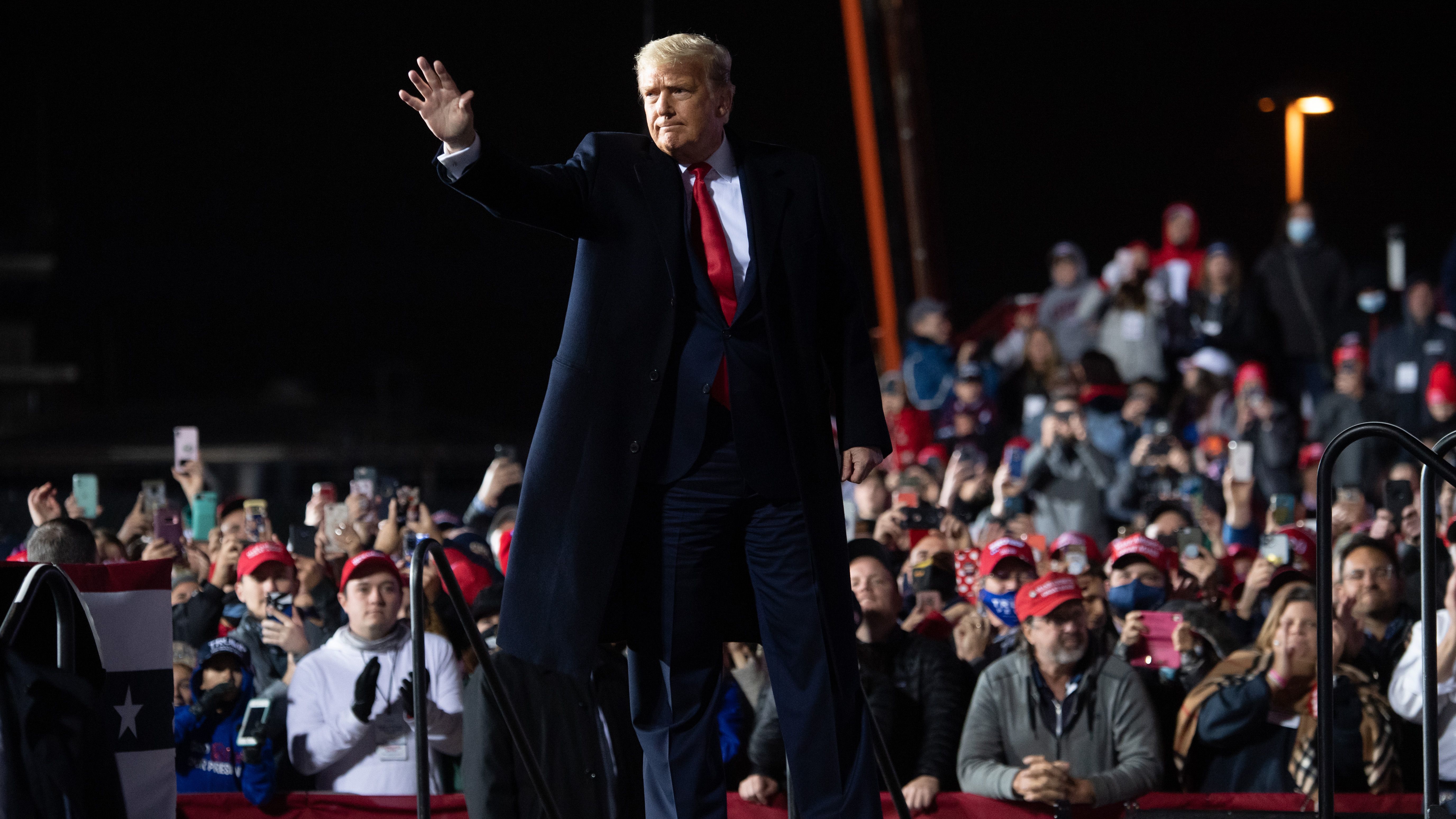 President Trump waves at the end of a rally at Erie International Airport in Erie, Pa., on Tuesday evening. (AFP via Getty Images)