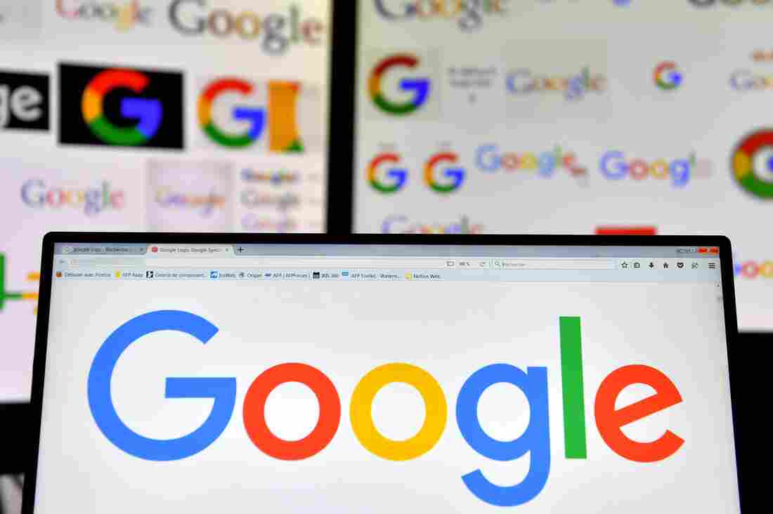 A picture taken on November 20, 2017 shows logos of US multinational technology company Google displayed on computers' screens.