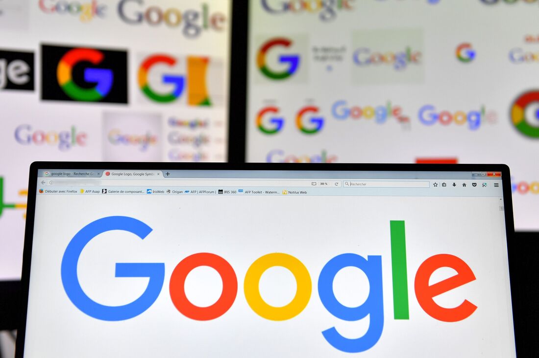 A picture taken on November 20, 2017 shows logos of US multinational technology company Google displayed on computers' screens.