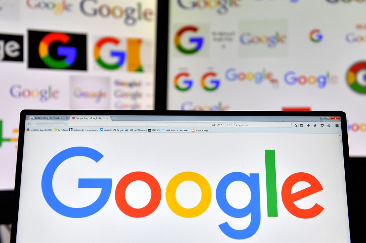 A picture taken on November 20, 2017 shows logos of US multinational technology company Google displayed on computers' screens.