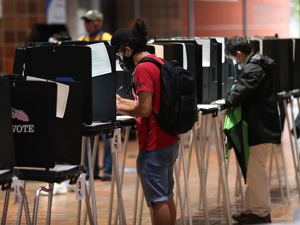 Voters fill out ballots this week at the Stephen P. Clark Government Center polling station in Miami.