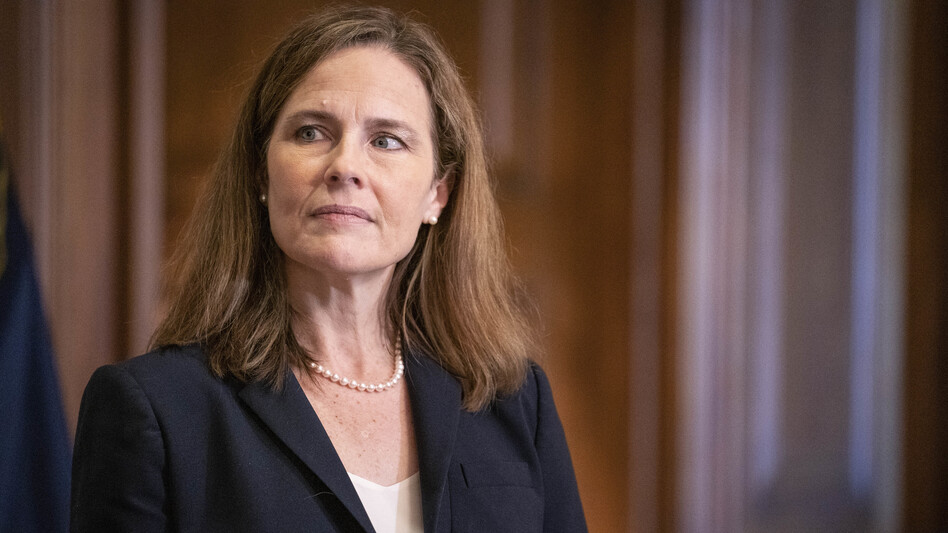 In a near-party-line vote Sunday, Senate Republicans advanced President Trump's Supreme Court nominee, Judge Amy Coney Barrett, seen here on Capitol Hill on Wednesday. A final confirmation vote is set for Monday evening. (Sarah Silbiger/Pool/Getty Images)
