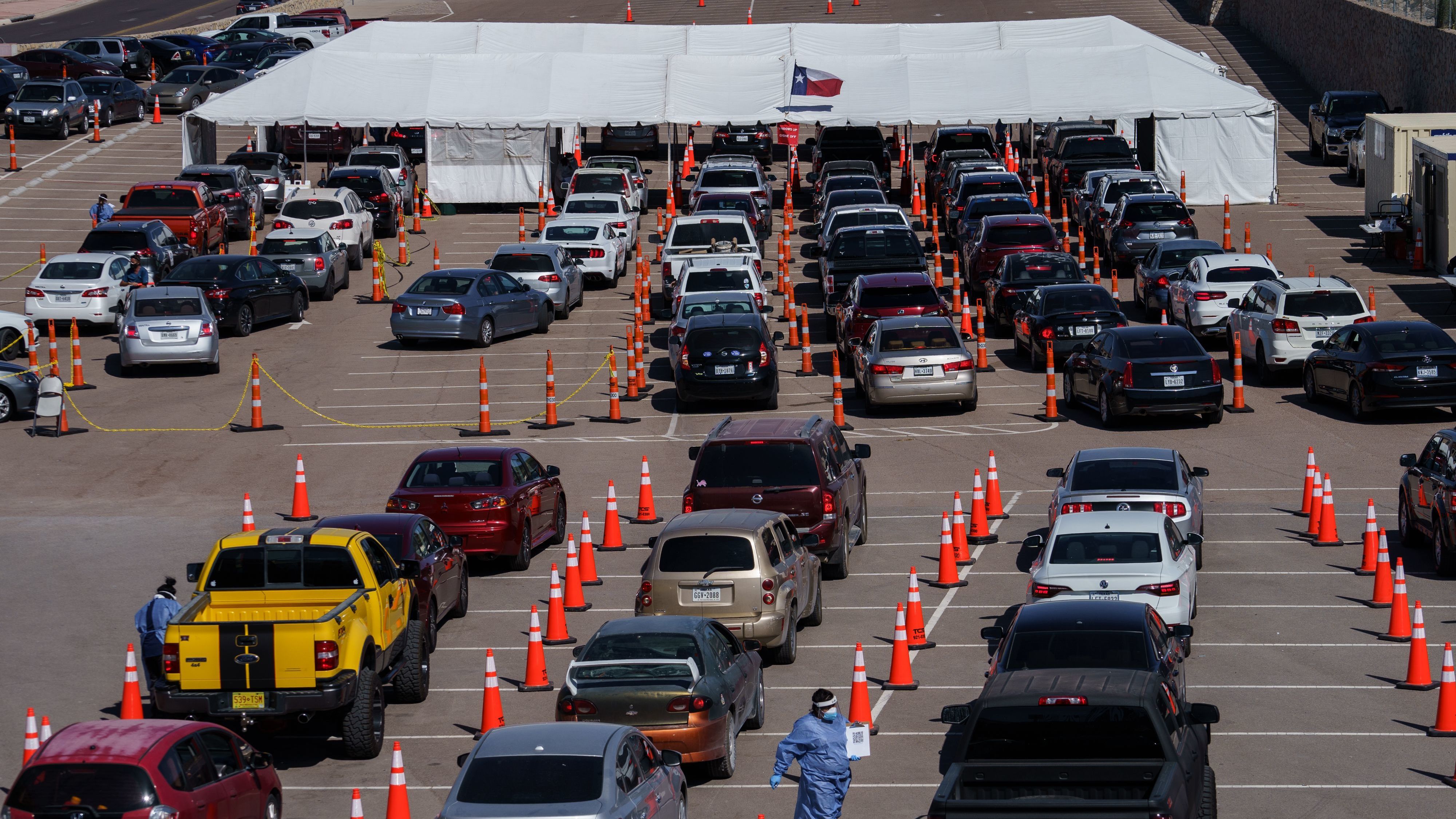 Cars line up Friday at a coronavirus testing site at the University of Texas at El Paso. The area has seen a surge in cases in recent weeks, and a two-week curfew is now in effect in El Paso County.