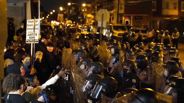 Protesters confront police during a march in Philadelphia on Tuesday, following the death of Walter Wallace, a Black man who was killed by police in the city on Monday.