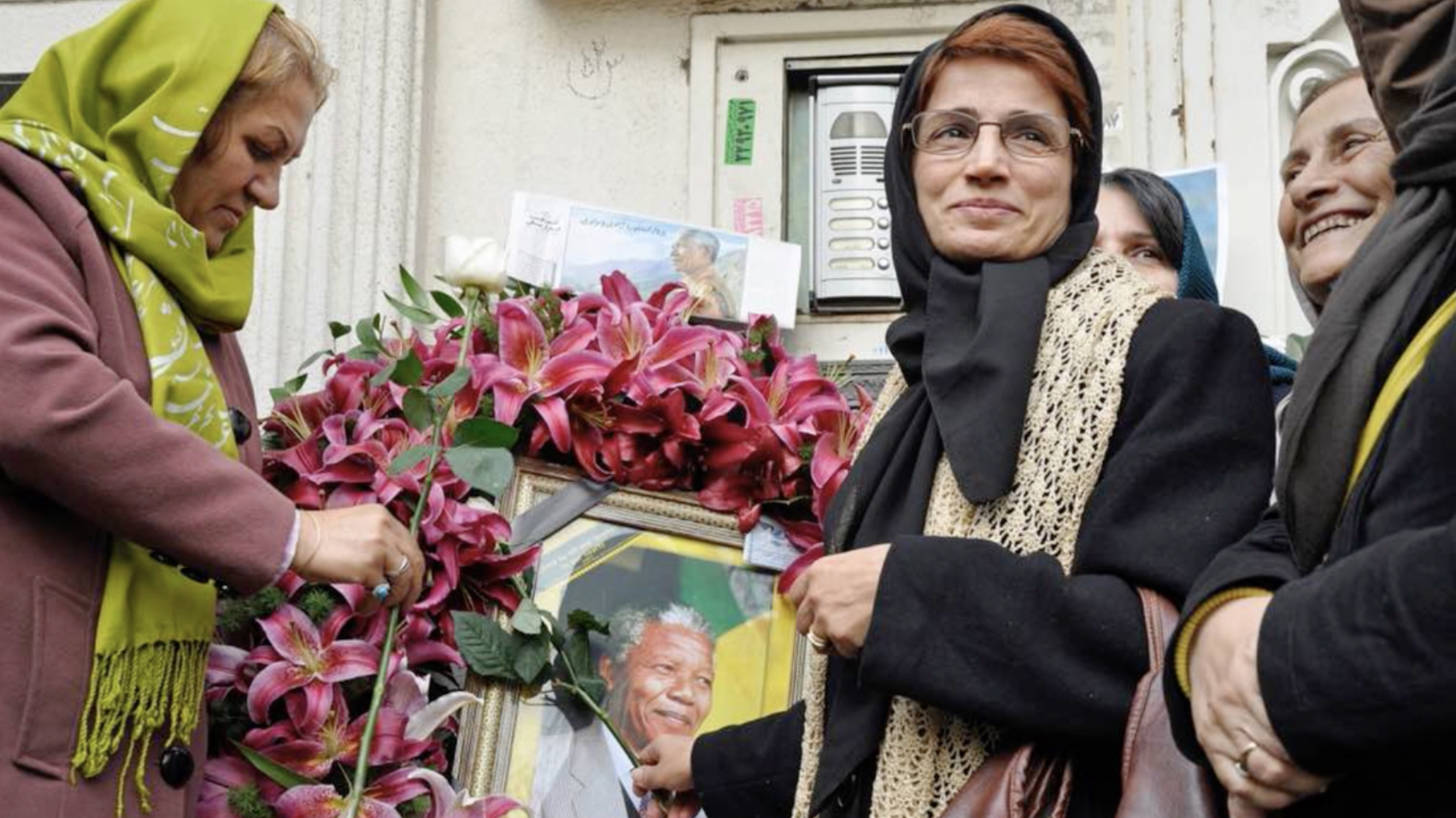 Iranian human rights lawyer Nasrin Sotoudeh with a poster of South Africa