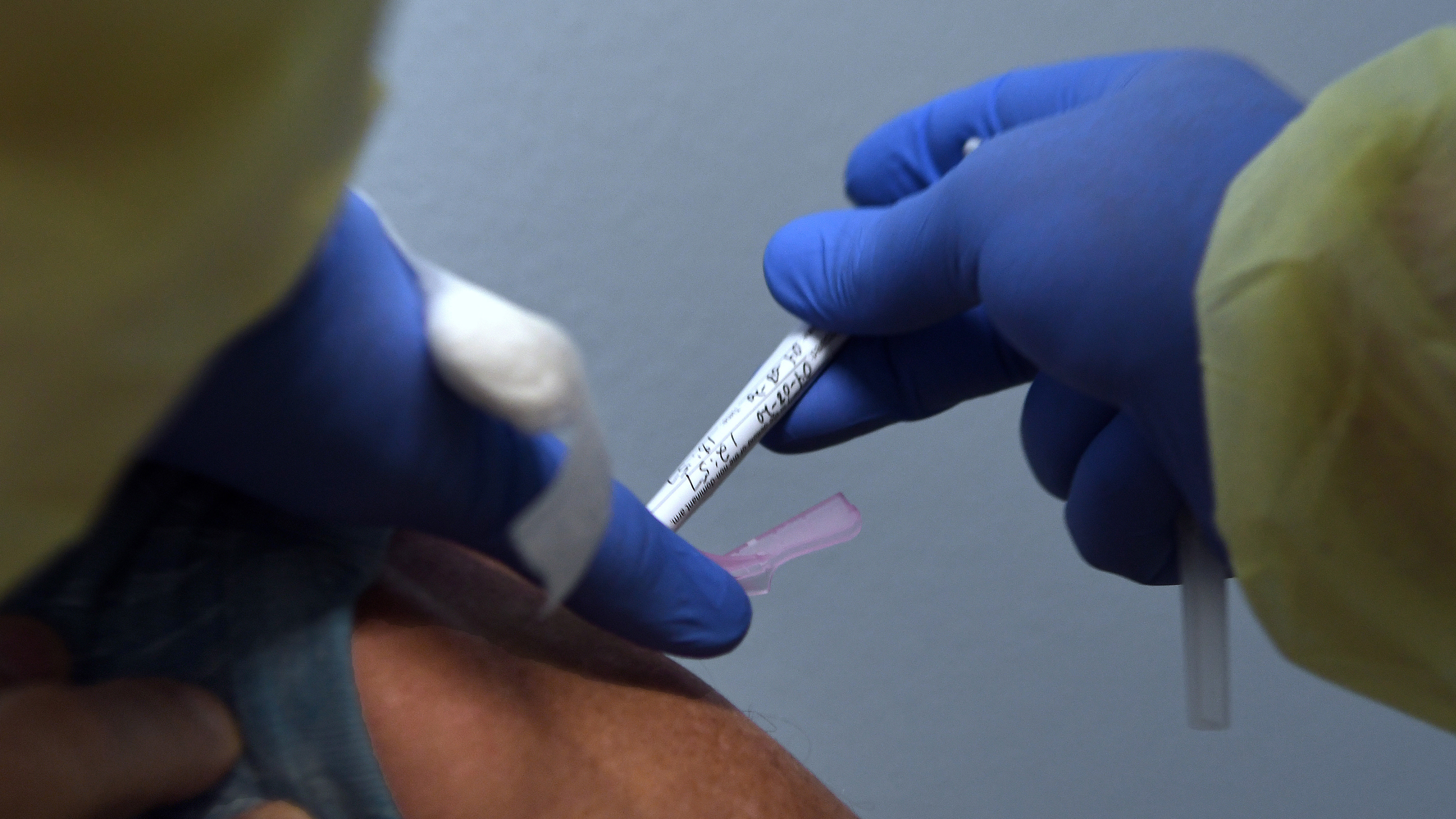 Tony Potts, a 69-year-old retiree living in Ormond Beach, Fla., receives his first injection earlier this year as a participant in a Phase 3 clinical trial of Moderna