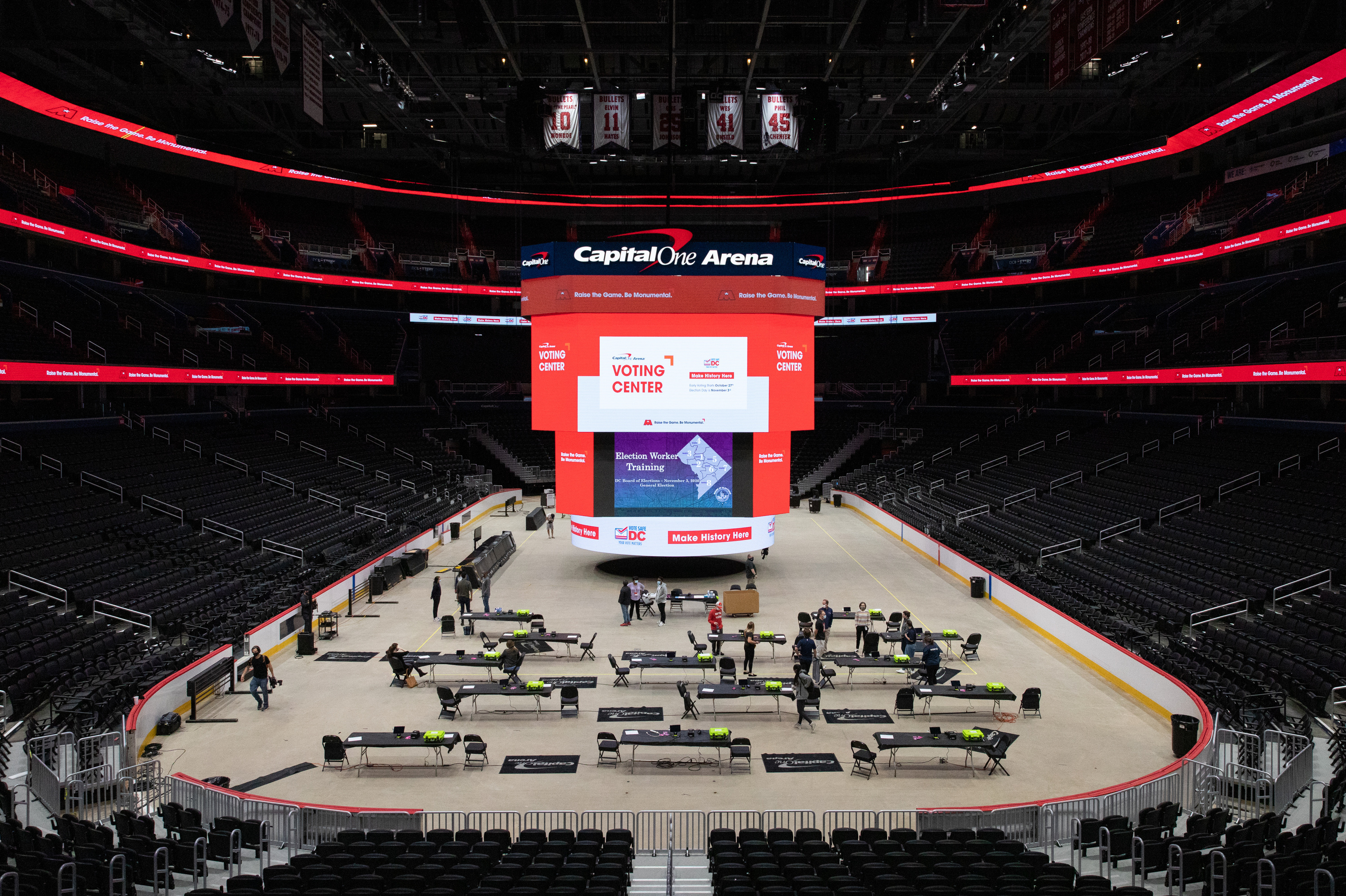 Voting trainers prepare to instruct poll workers in preparation for early voting at Capital One Arena in Washington, D.C., on Oct. 19. (Amanda Andrade-Rhoades for NPR)