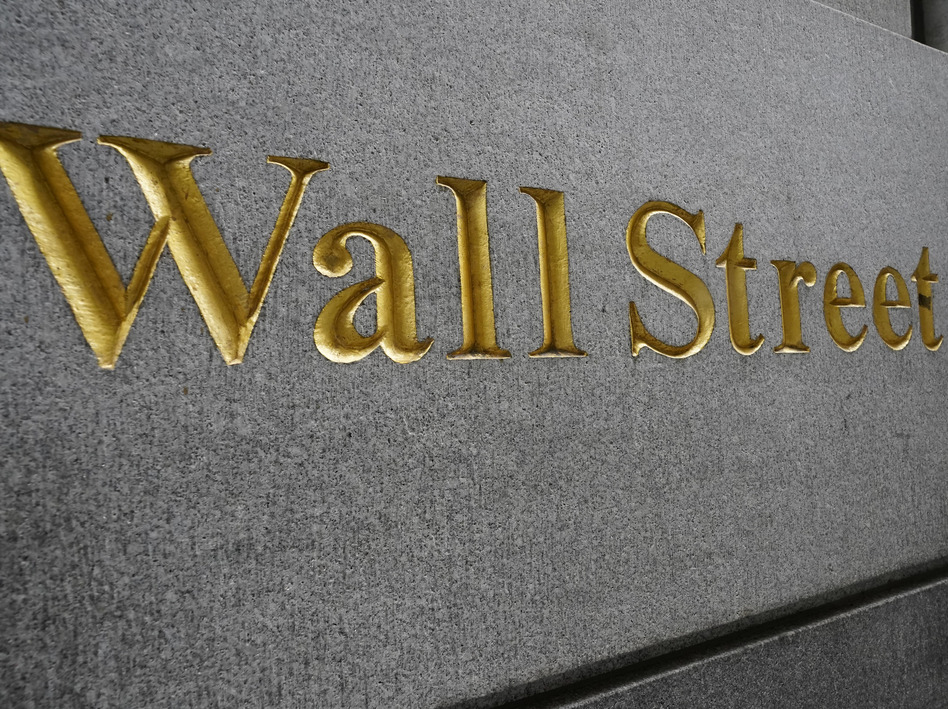 "Wall Street" is etched on a building across the street from the New York Stock Exchange in September. Stocks are rallying as voters head to the polls Tuesday. (Mary Altaffer/AP)