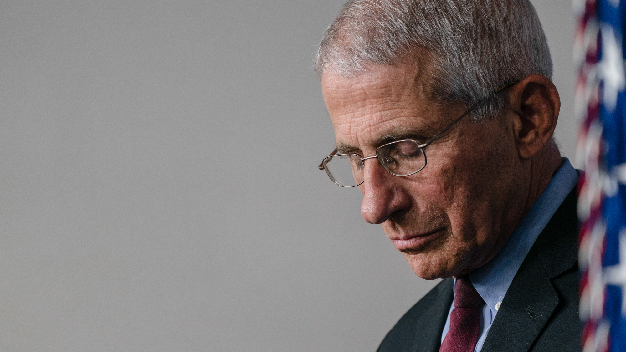 Dr. Anthony Fauci, Director of the National Institute of Allergy and Infectious Diseases listens as U.S. President Donald Trump answers questions in the press briefing room with members of the White House Coronavirus Task Force.