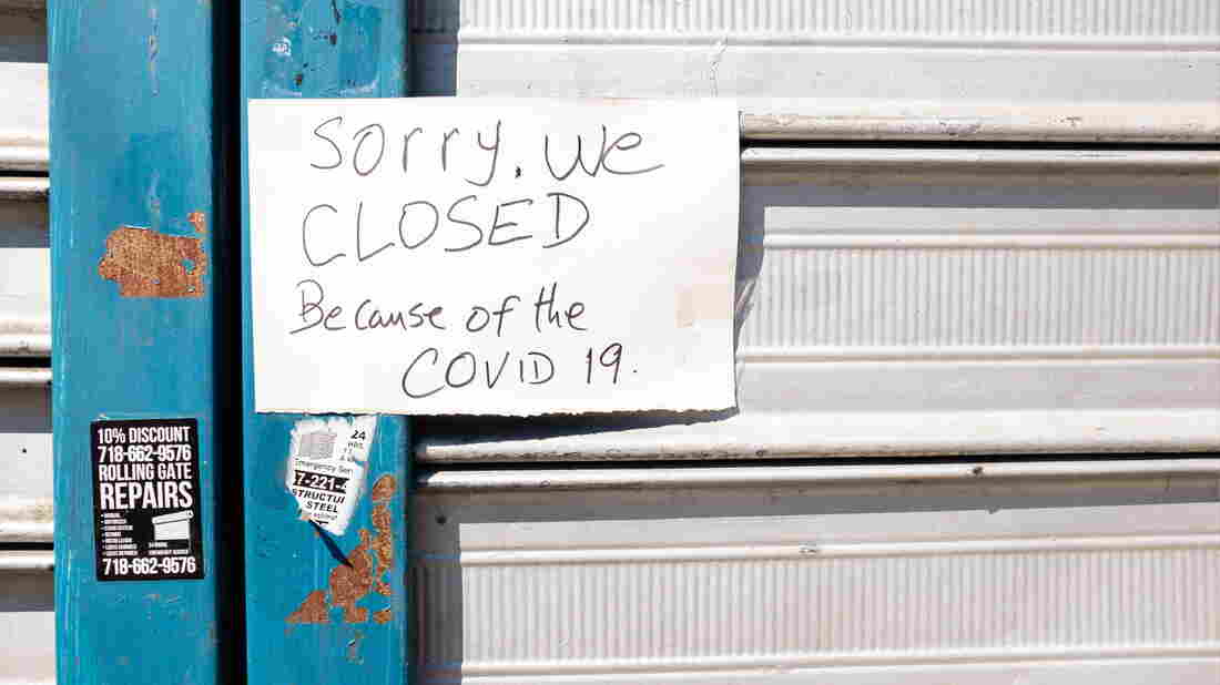 Brooklyn, NY - 26 March 2020. Residents of New York City have been asked to stay home as a result of the novel coronavirus, and all but essential businesses have been asked to close. A sign on a closed laundromat on Avenue J.