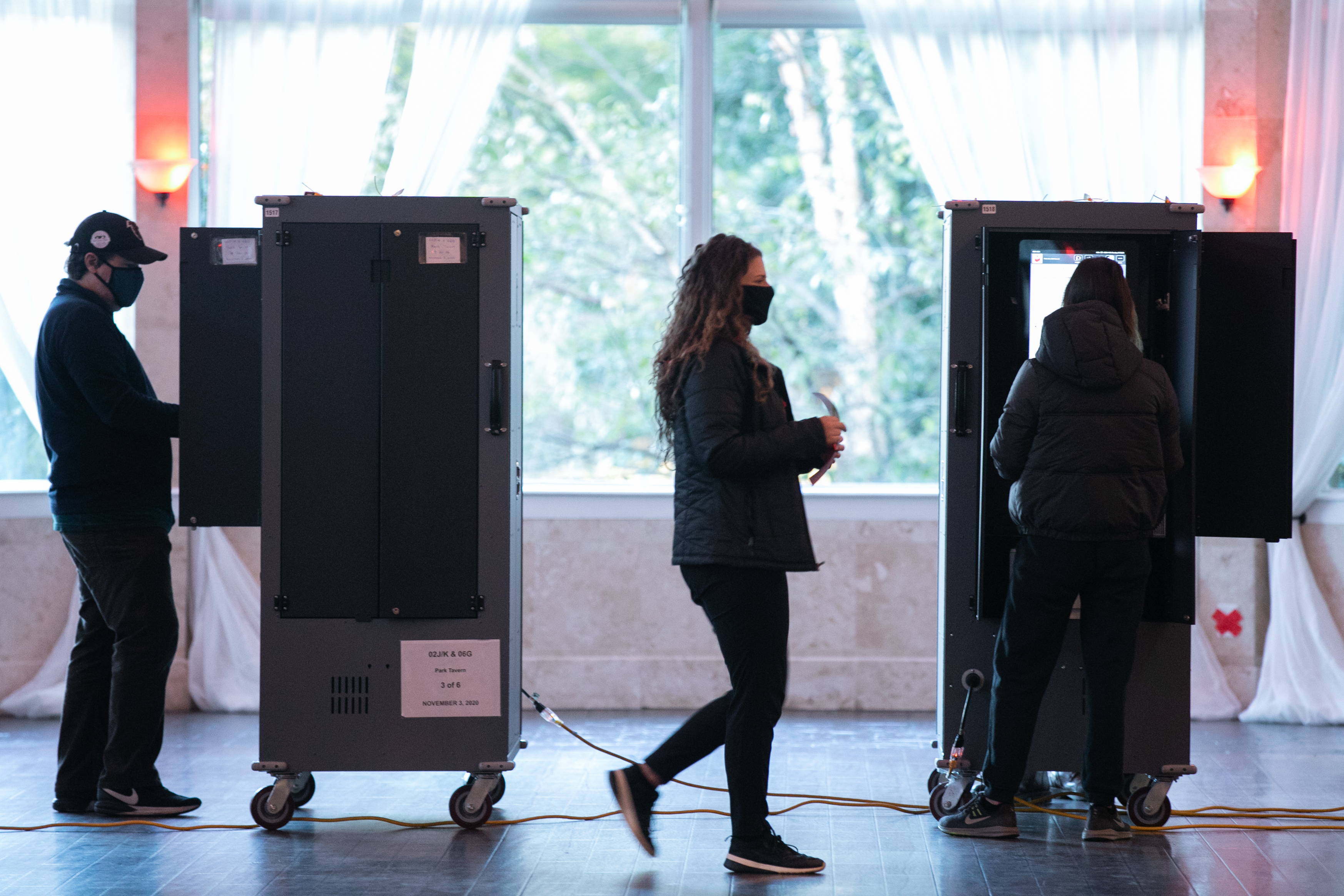 Voters cast ballots Tuesday at the Park Tavern polling station in Atlanta. (Getty Images)