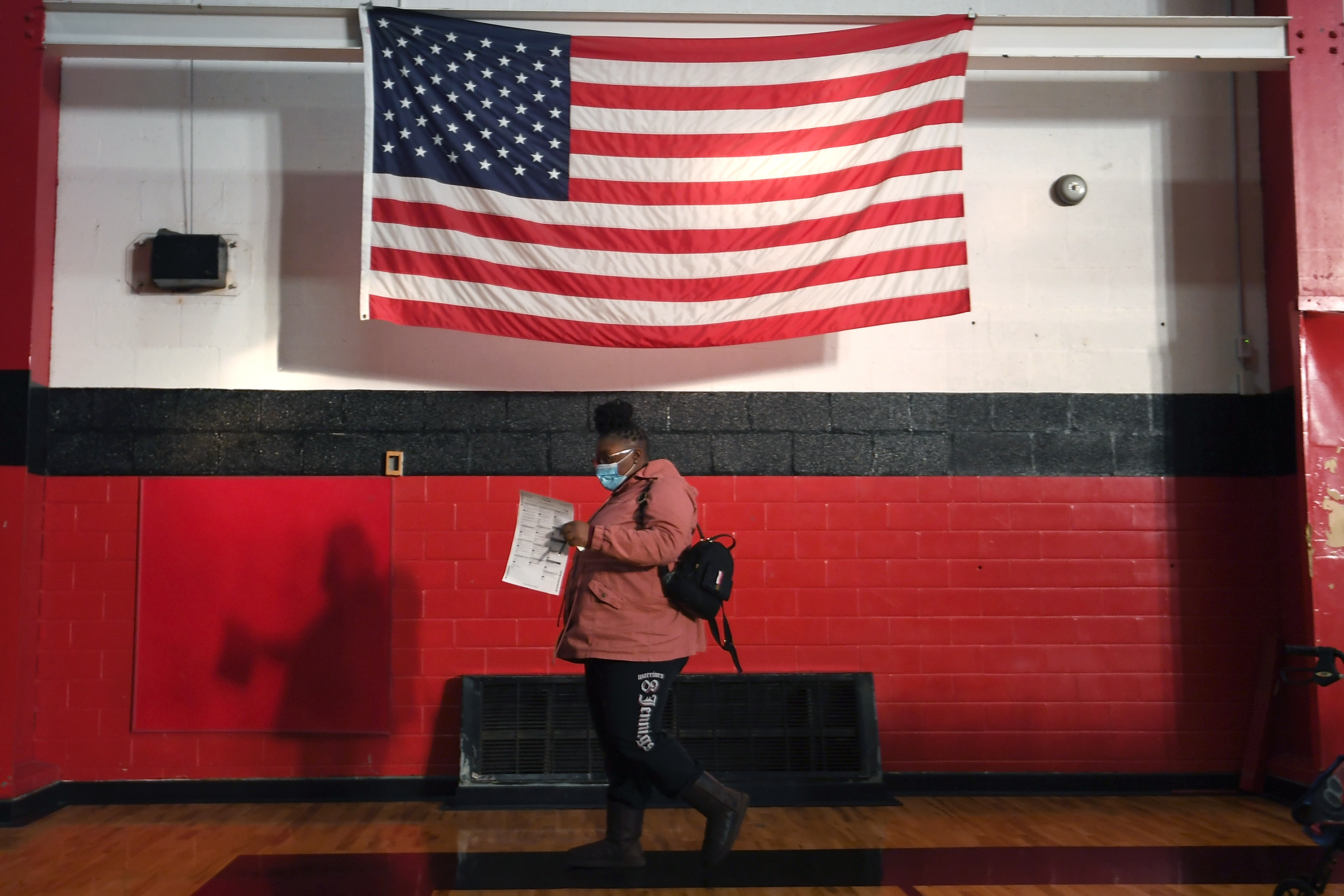 A voter casts a ballot on Tuesday at Jennings Senior High School in Jennings, Mo., a St. Louis suburb. Voters passed an amendment to Missouri's constitution that opens the door to redrawing state legislative districts that don't take into account children, noncitizens and other residents who are not eligible to vote. (Getty Images)