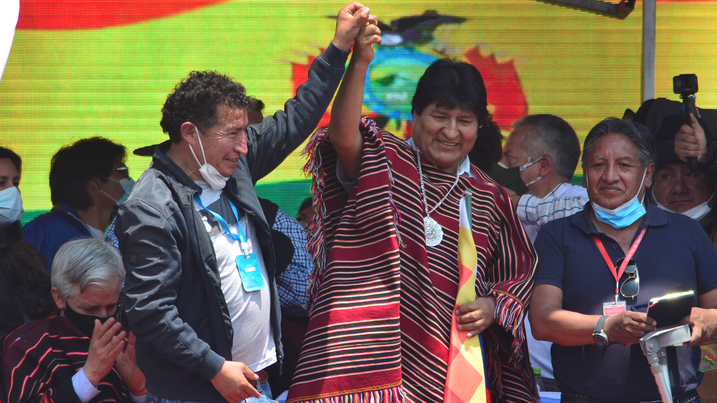 Former Bolivian President Evo Morales (middle) greets supporters during a welcoming ceremony after he crossed the border from Argentina after one year in exile on Monday, in Villazón, Bolivia.