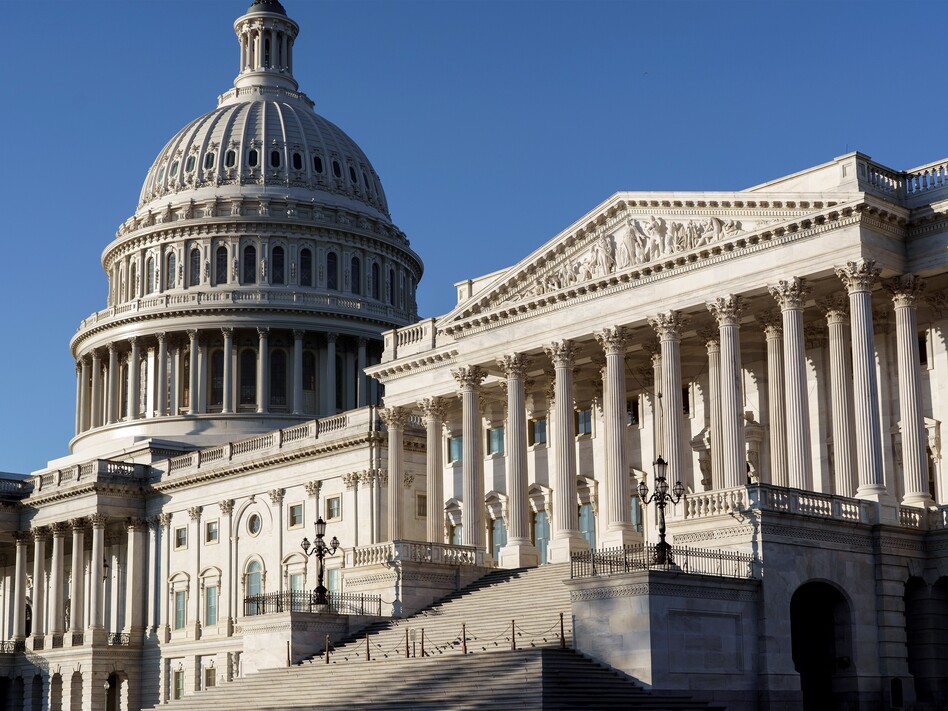 The Senate side of the Capitol is seen in Washington, D.C., early Monday. Experts say President-elect Joe Biden's ability to reshape the U.S. immigration system will be sharply limited if Republicans retain control of the Senate. (J. Scott Applewhite/AP)