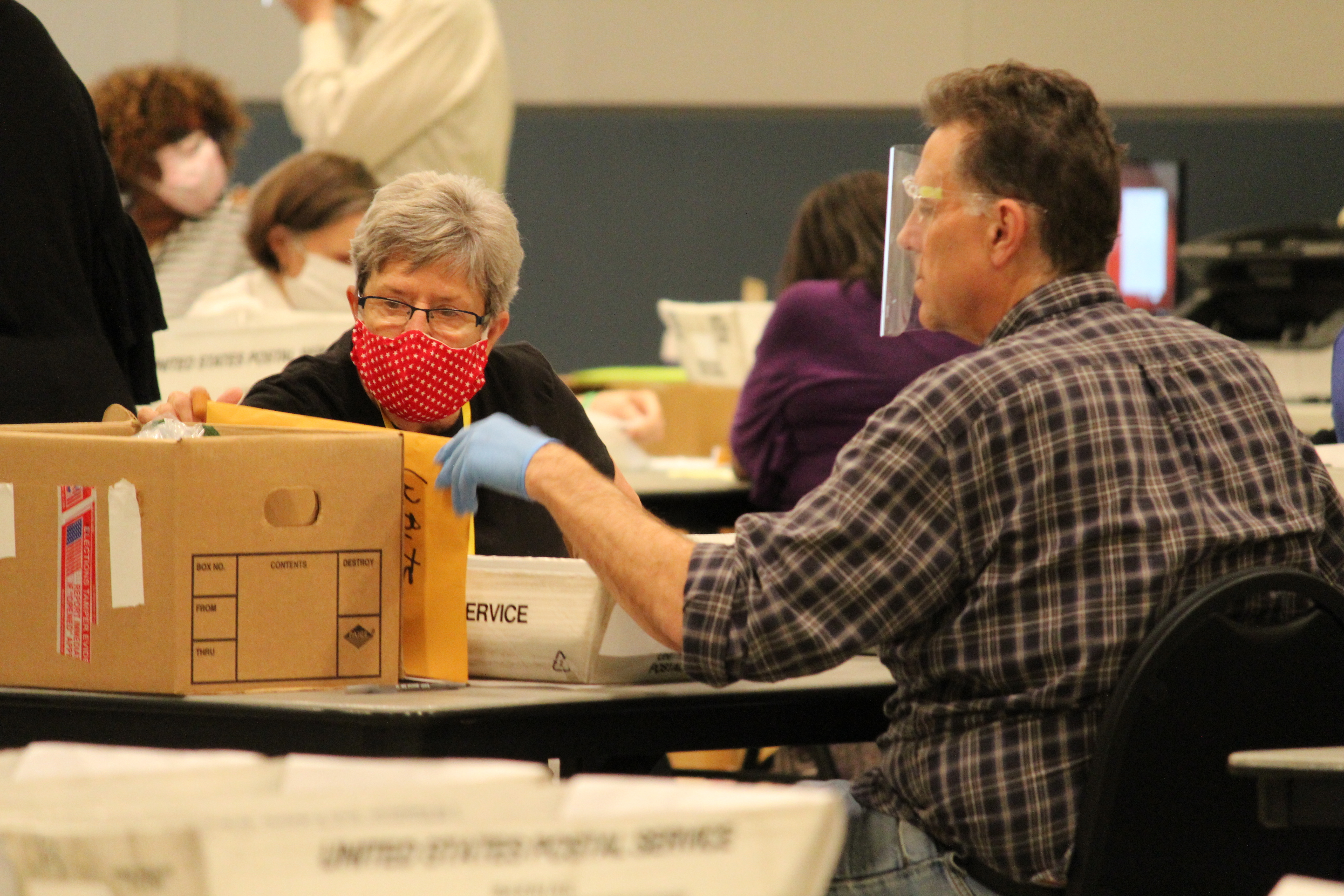Election workers in Cobb County, Ga., begin a hand recount of ballots Friday in the presidential election. (WABE)