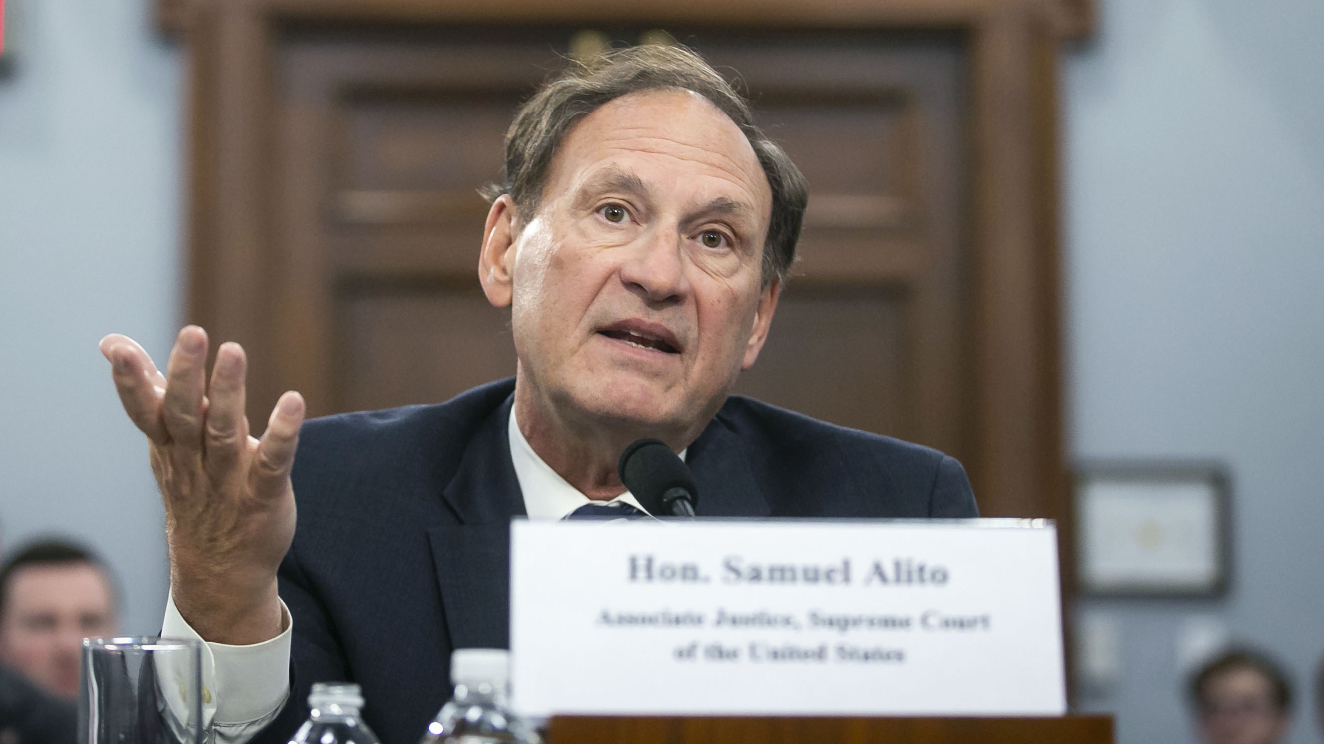 Justice Samuel Alito speaks at a hearing last year on Capitol Hill. &quot;We have never before seen restrictions as severe, extensive and prolonged as those experienced for most of 2020,&quot; Alito said in a speech this week to the Federalist Society's National Lawyers Convention. (Bloomberg via Getty Images)