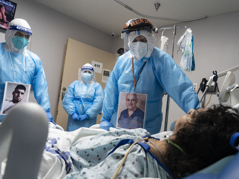 Medical staff members check on a patient at the COVID-19 ICU in United Memorial Medical Center in Houston, Texas. Cases and hospitalizations rose dramatically in the U.S. this week. (Bloomberg via Getty Images)