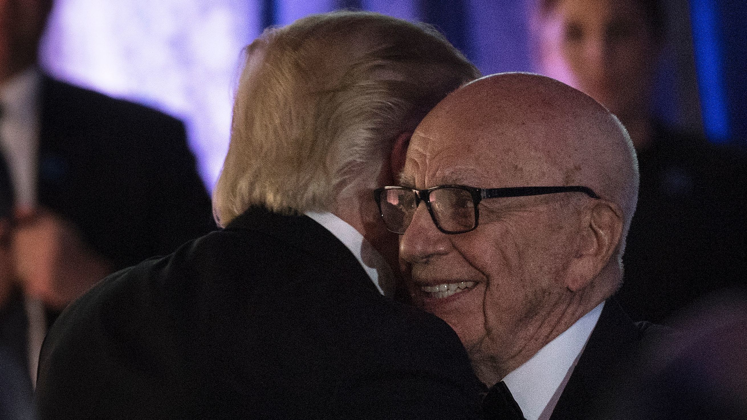 President Trump embraces Rupert Murdoch, co-chairman of Fox Corp., at a dinner in 2017. Once close, Trump is now angry at Murdoch