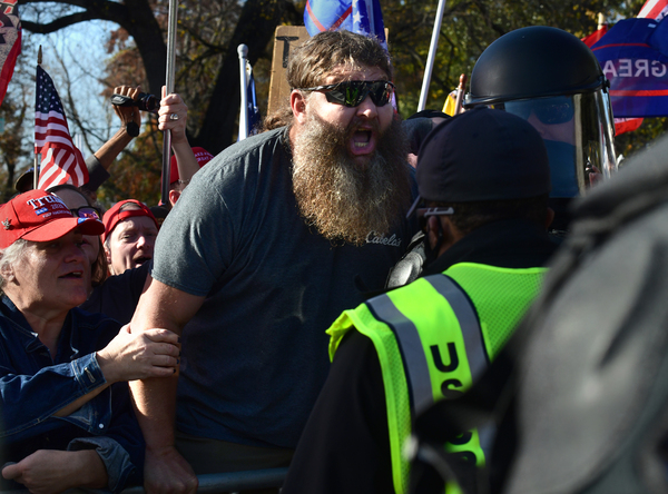 Trump supporters rally as opposing views clash during the march.