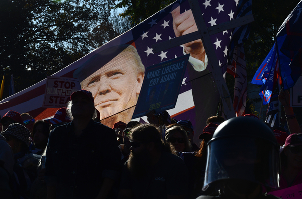 Demonstrators raise a flag during the march.