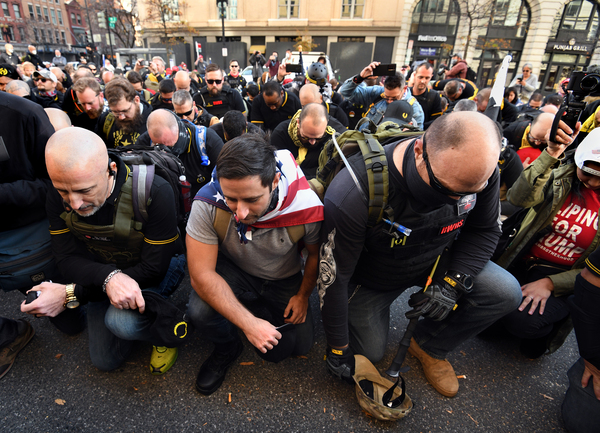 The Proud Boys pray before the march as supporters of President Trump rally at Freedom Plaza and the Supreme Court.