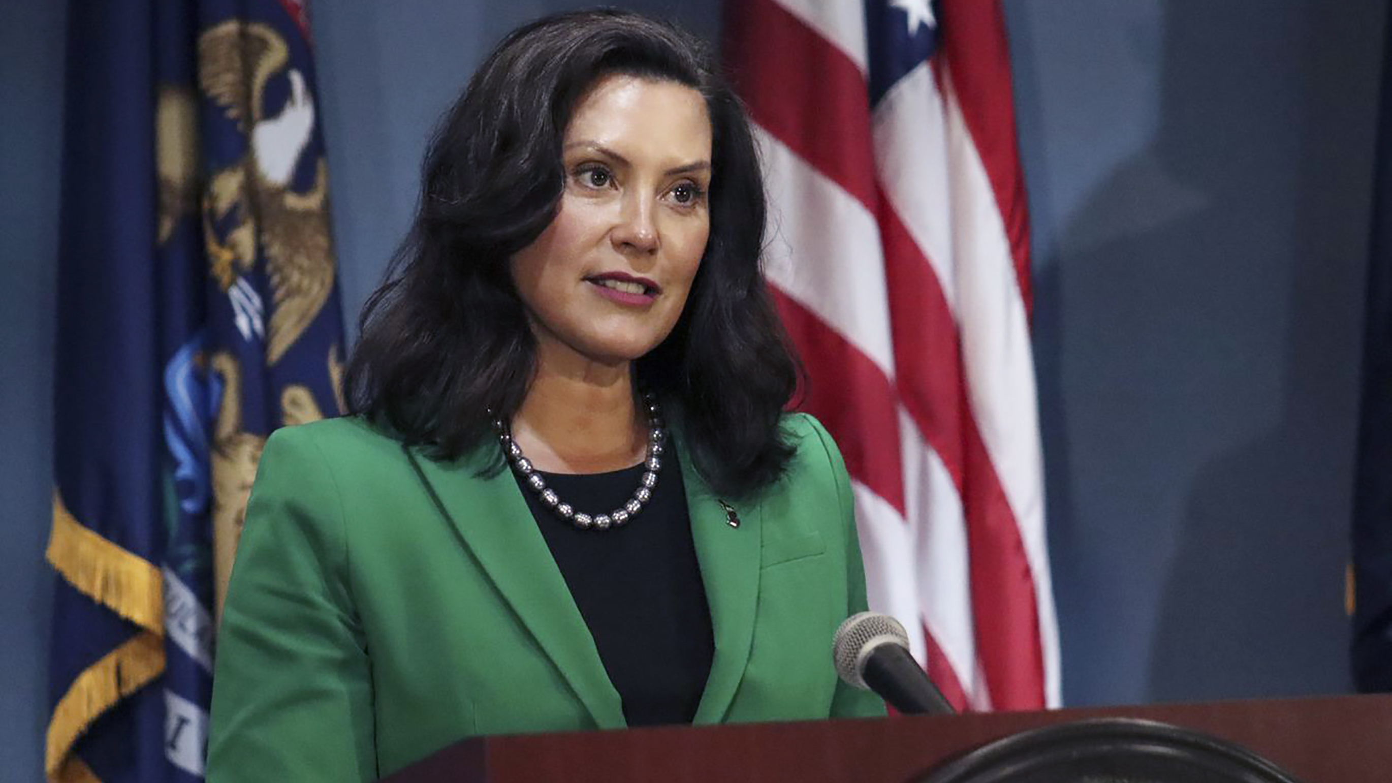"In the spring, we listened to public health experts, stomped the curve, and saved thousands of lives together. Now, we must channel that same energy and join forces again to protect our families, frontline workers and small businesses," Michigan Gov. Gretchen Whitmer, shown here at a press conference in August, said in a statement.