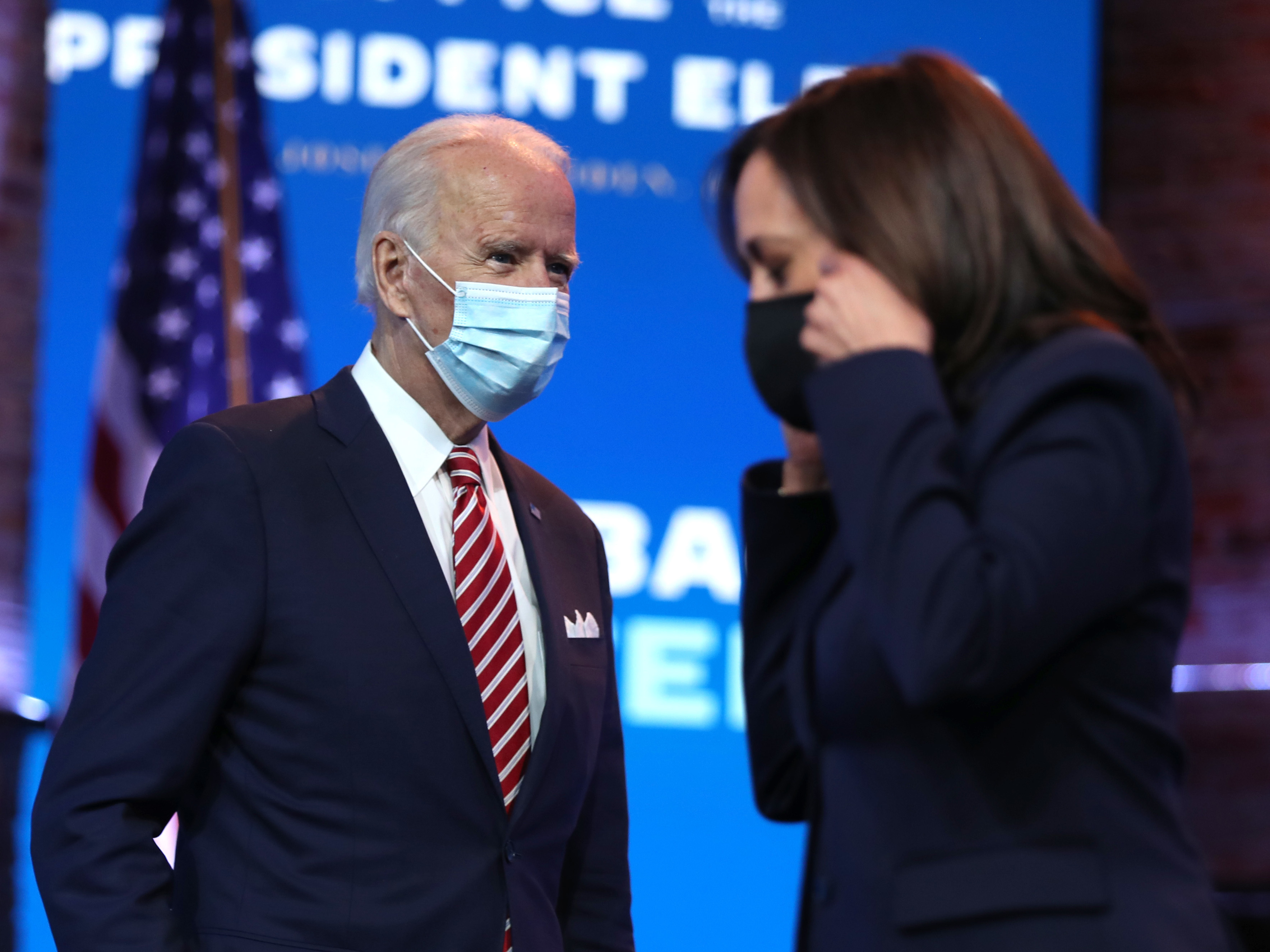President-elect Joe Biden walks by Vice President-elect Kamala Harris before delivering remarks on his plan for economic recovery under his incoming administration. (Getty Images)