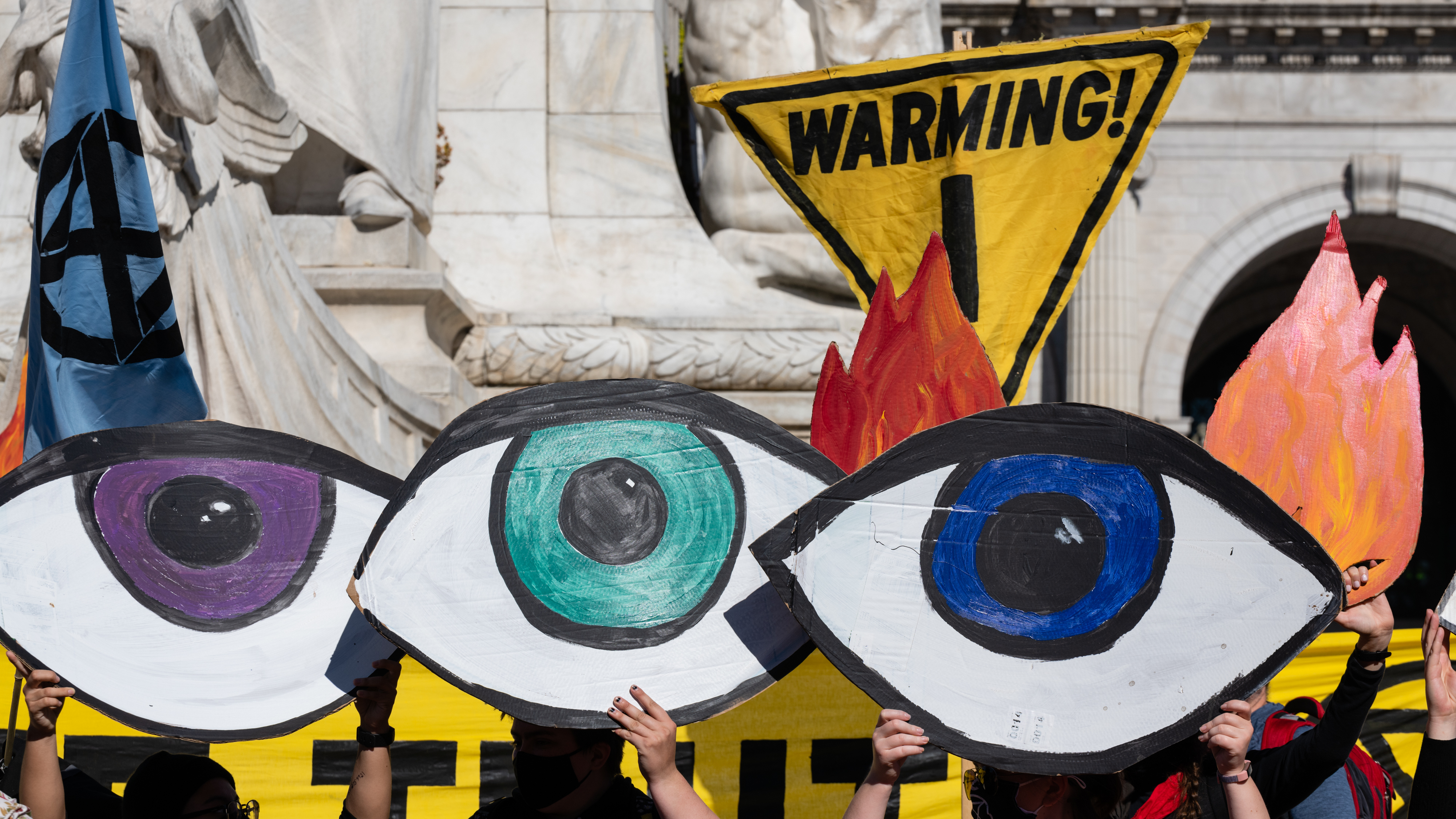 Climate activists protest in Washington, D.C., the day after the election. Some progressives want President-elect Joe Biden to bar any appointees with fossil fuel ties. (Bloomberg via Getty Images)