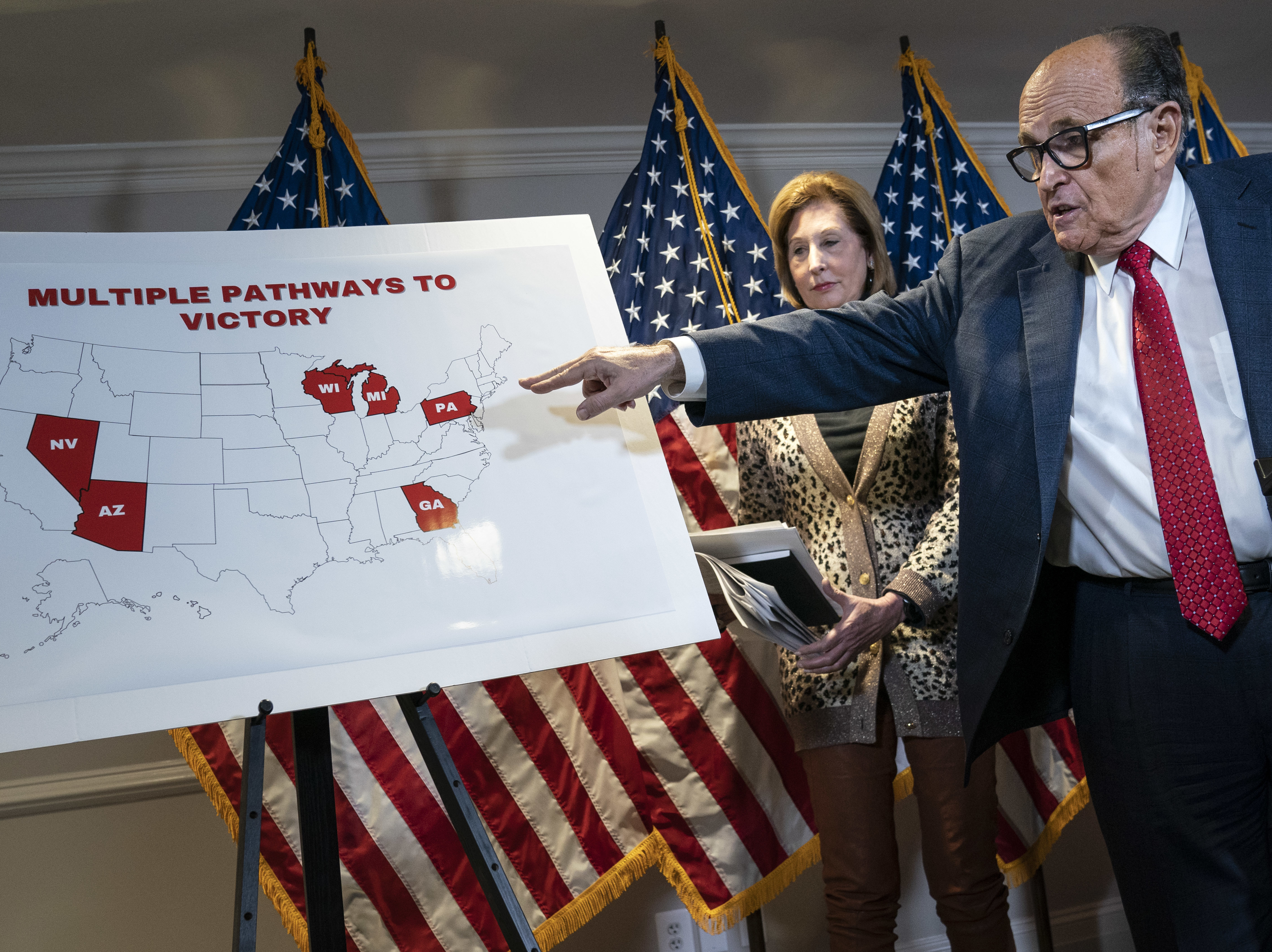 President Trump's lawyer Rudy Giuliani points to a map Thursday while speaking to the press about lawsuits related to the 2020 election at the Republican National Committee headquarters in Washington, D.C. (Getty Images)