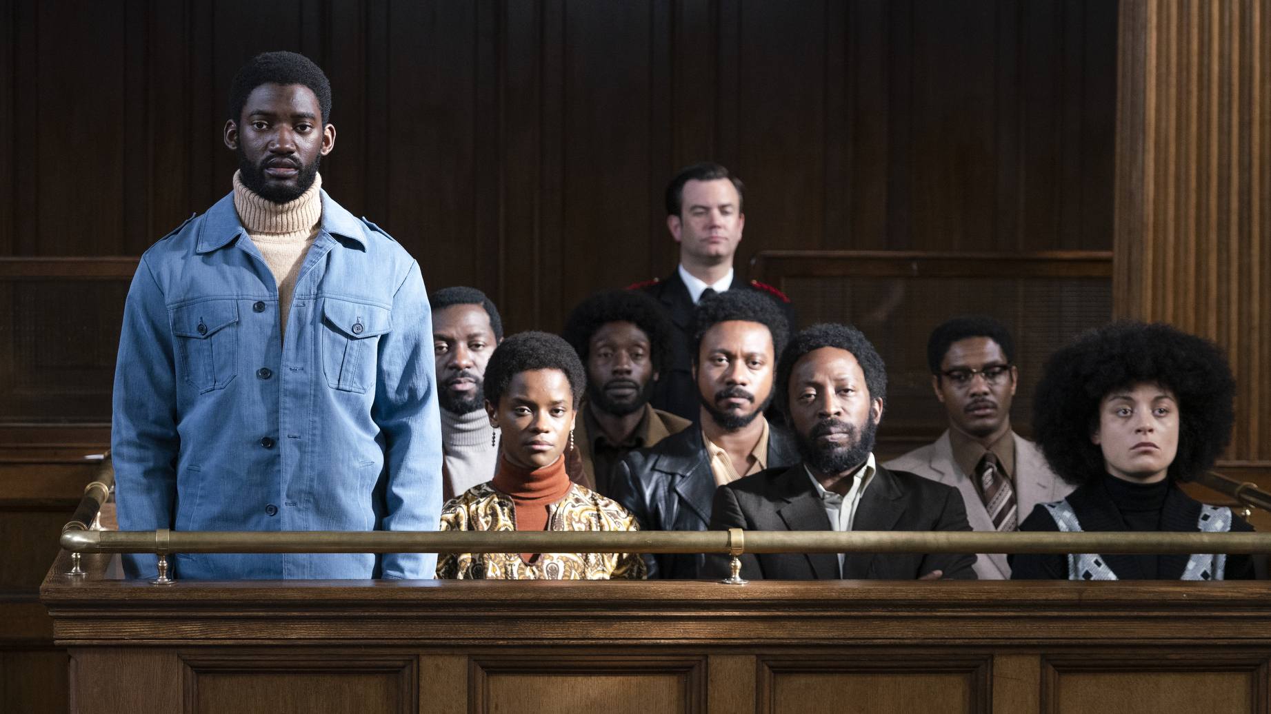 Malachi Kirby (standing) plays activist Darcus Howe in <em>Mangrove,</em> the first film in Steve McQueen's <em>Small Axe</em> anthology. (Amazon Prime Video)