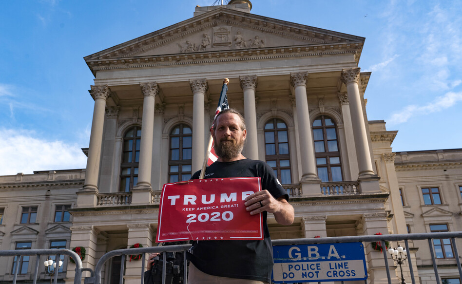 A supporter of President Trump protests outside the Georgia State Capitol on Saturday in Atlanta. The president's campaign has requested a vote recount in the state. (Megan Varner/Getty Images)