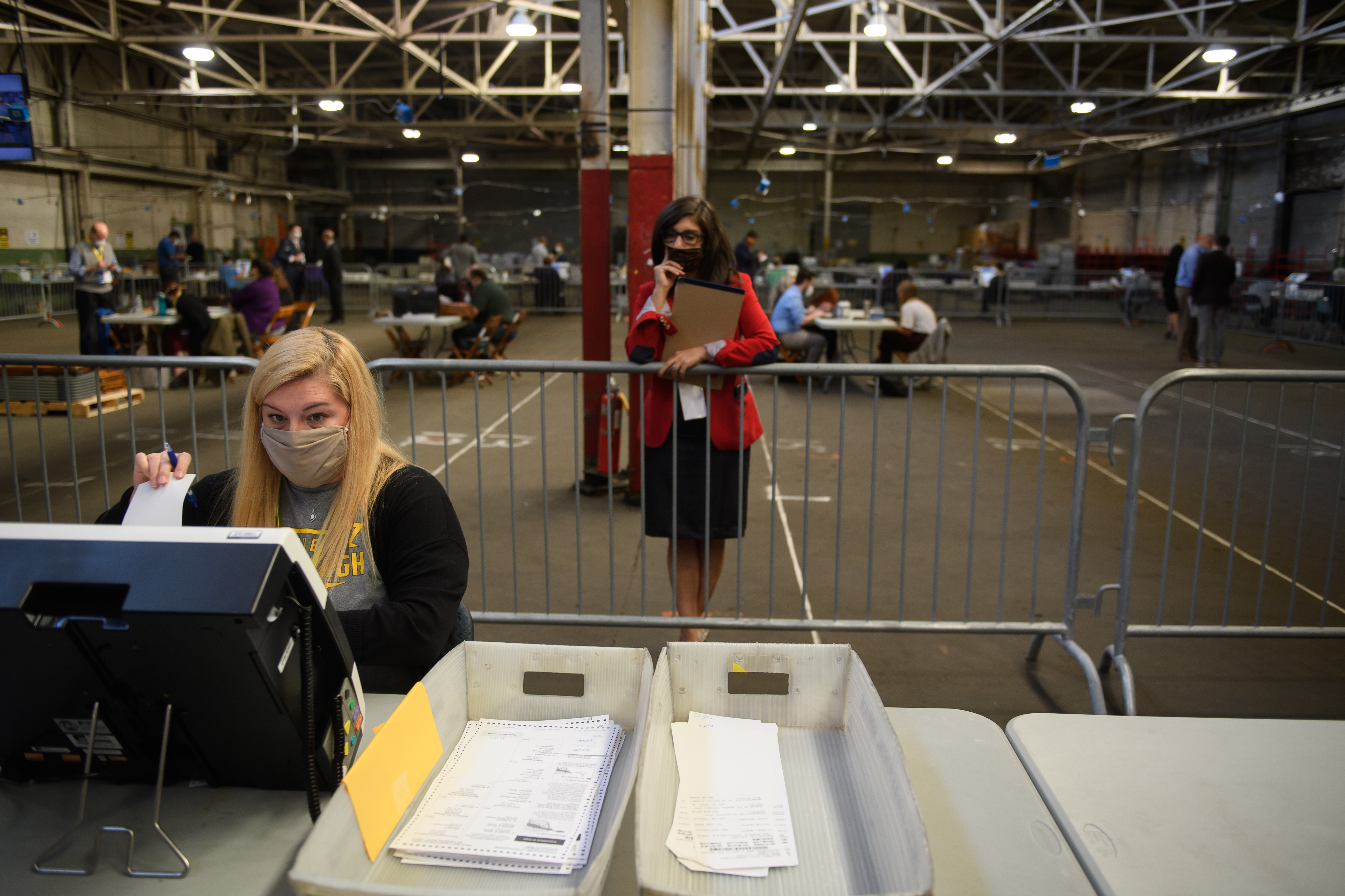 A poll watcher monitors the counting of ballots at the Allegheny County elections warehouse on Nov. 6 in Pittsburgh. (Getty Images)