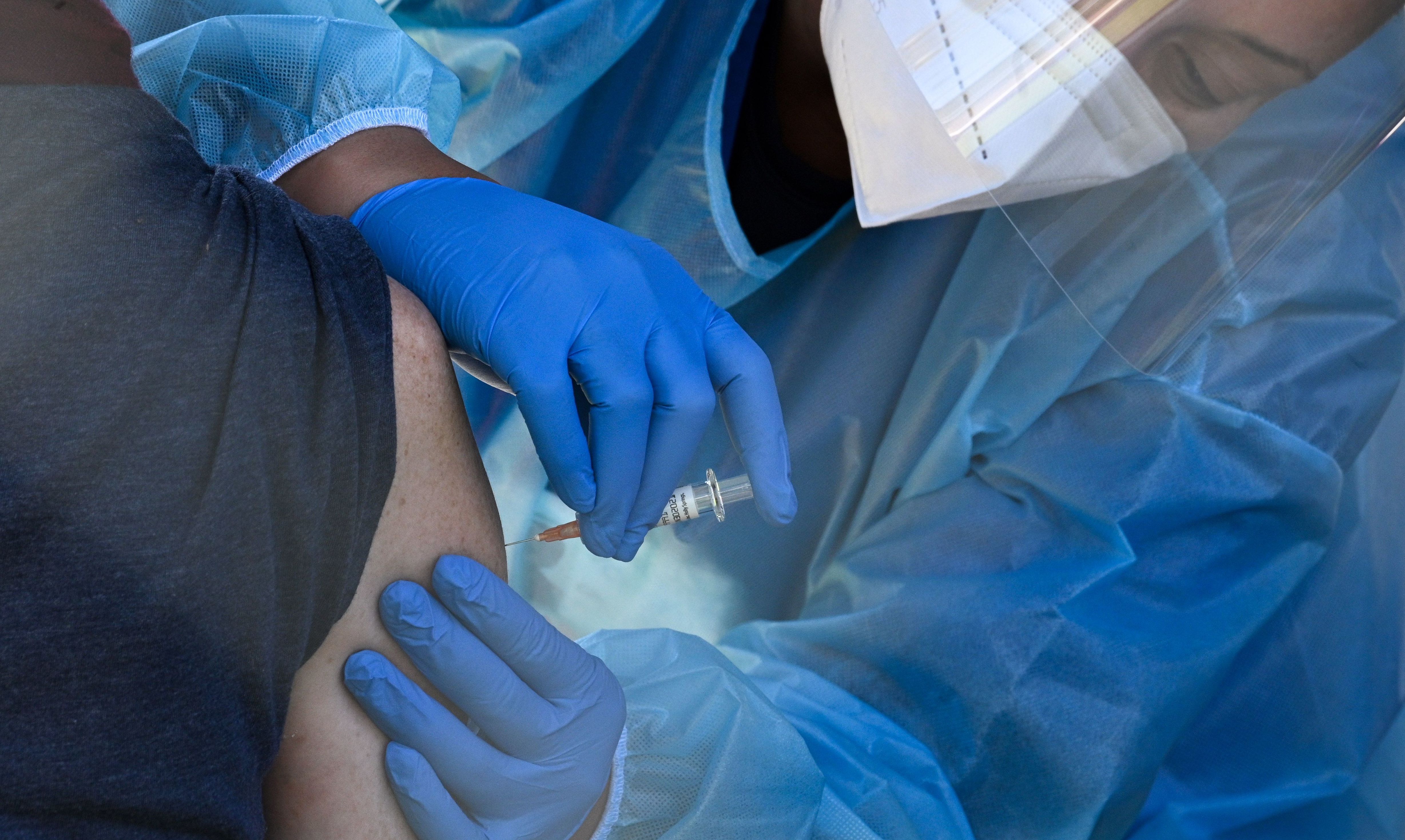 A flu vaccine is administered at a walk-up COVID-19 testing site, in San Fernando, Calif. Emergency use authorization is expected soon for vaccines for COVID-19. (AFP via Getty Images)