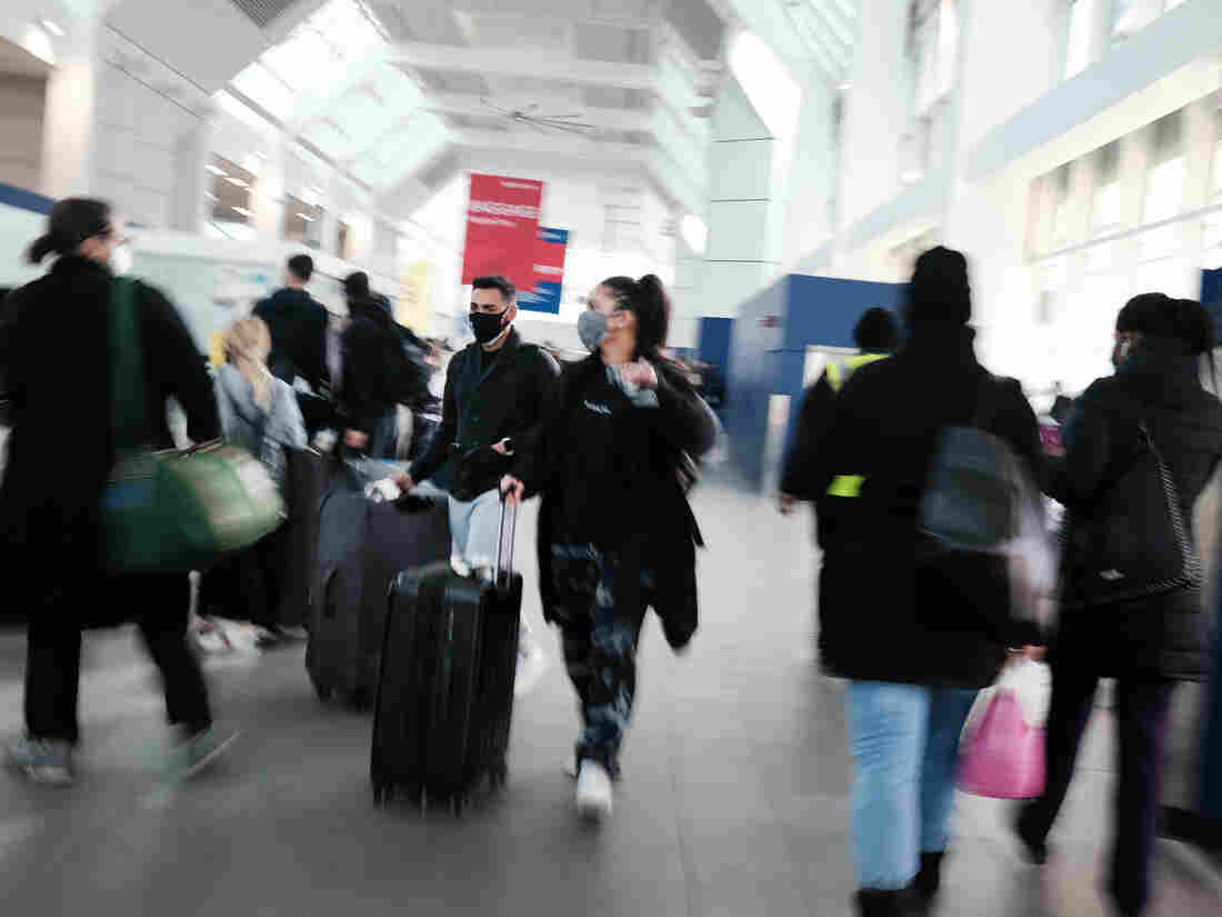 NEW YORK CITY - NOVEMBER 24: People walk through New York's LaGuardia Airport on November 24, 2020 in New York City. (Photo by Spencer Platt/Getty Images)