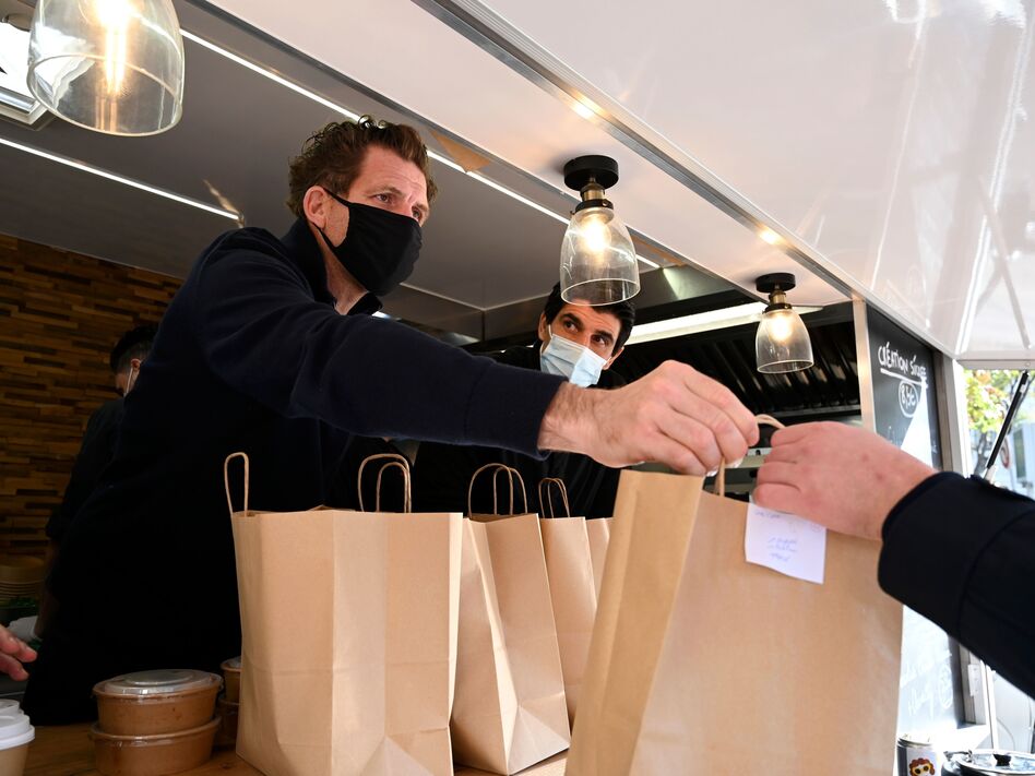 France announced some COVID-19 restrictions will ease this week after the country passed the peak of the virus's second wave. Restaurants will remain closed until January. (Nicolas Tucat/AFP via Getty Images)